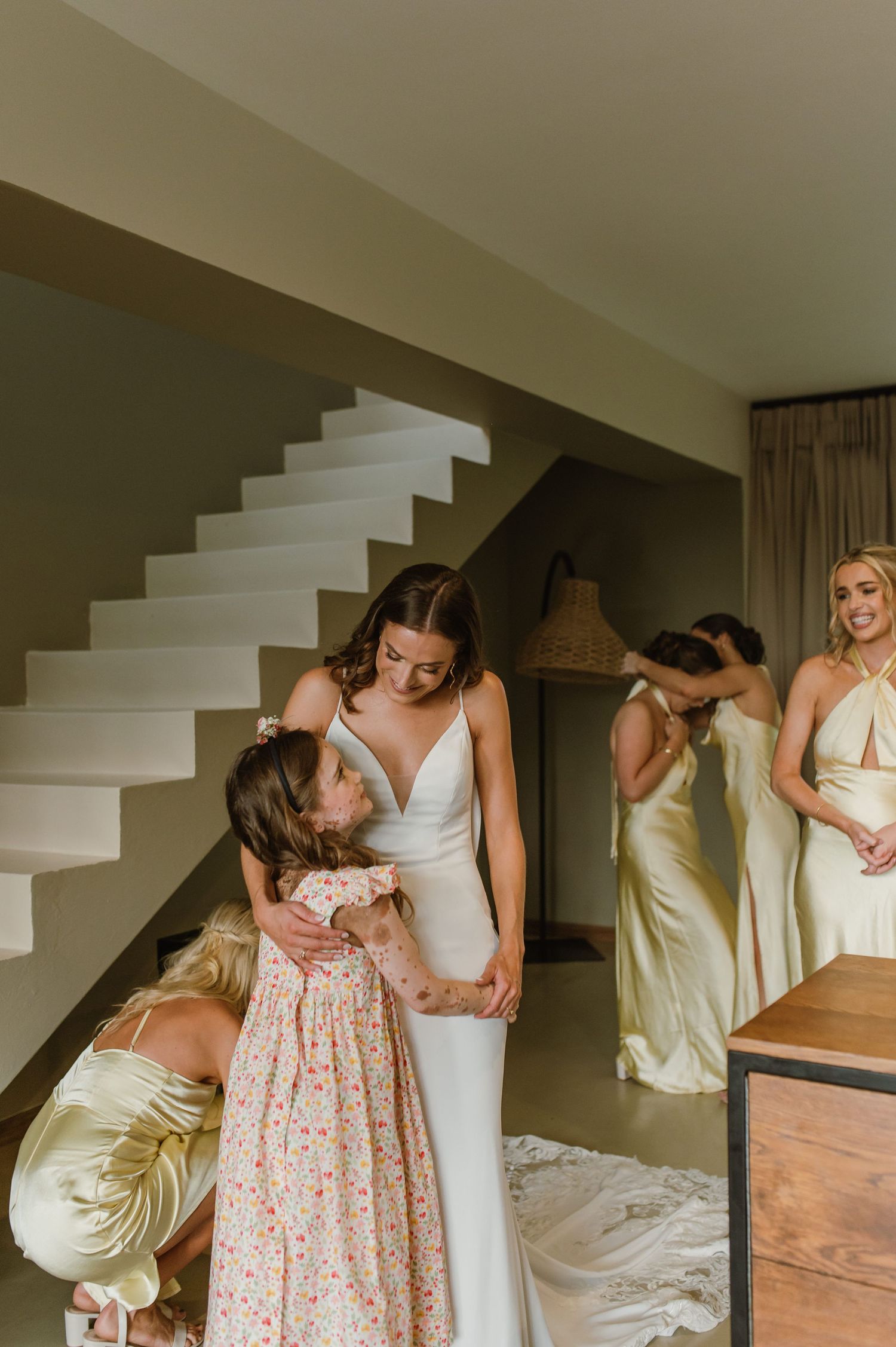 A series of emotional first look photos showing tender moments between two people in wedding attire.