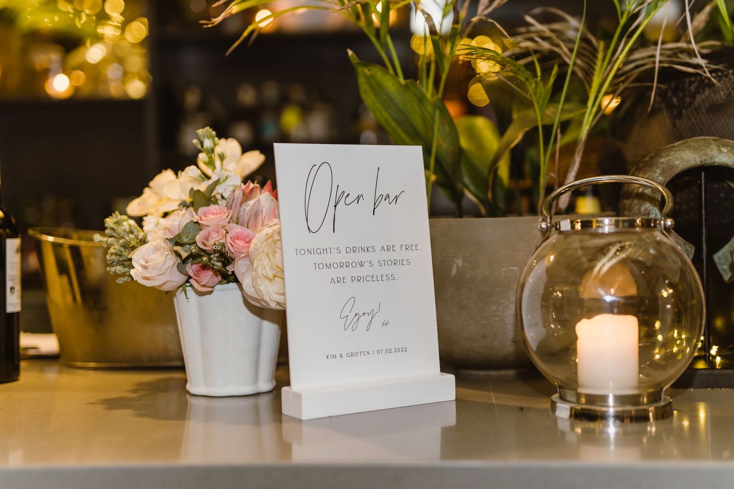 Elegant table settings with place cards and floral centerpieces at a formal event.