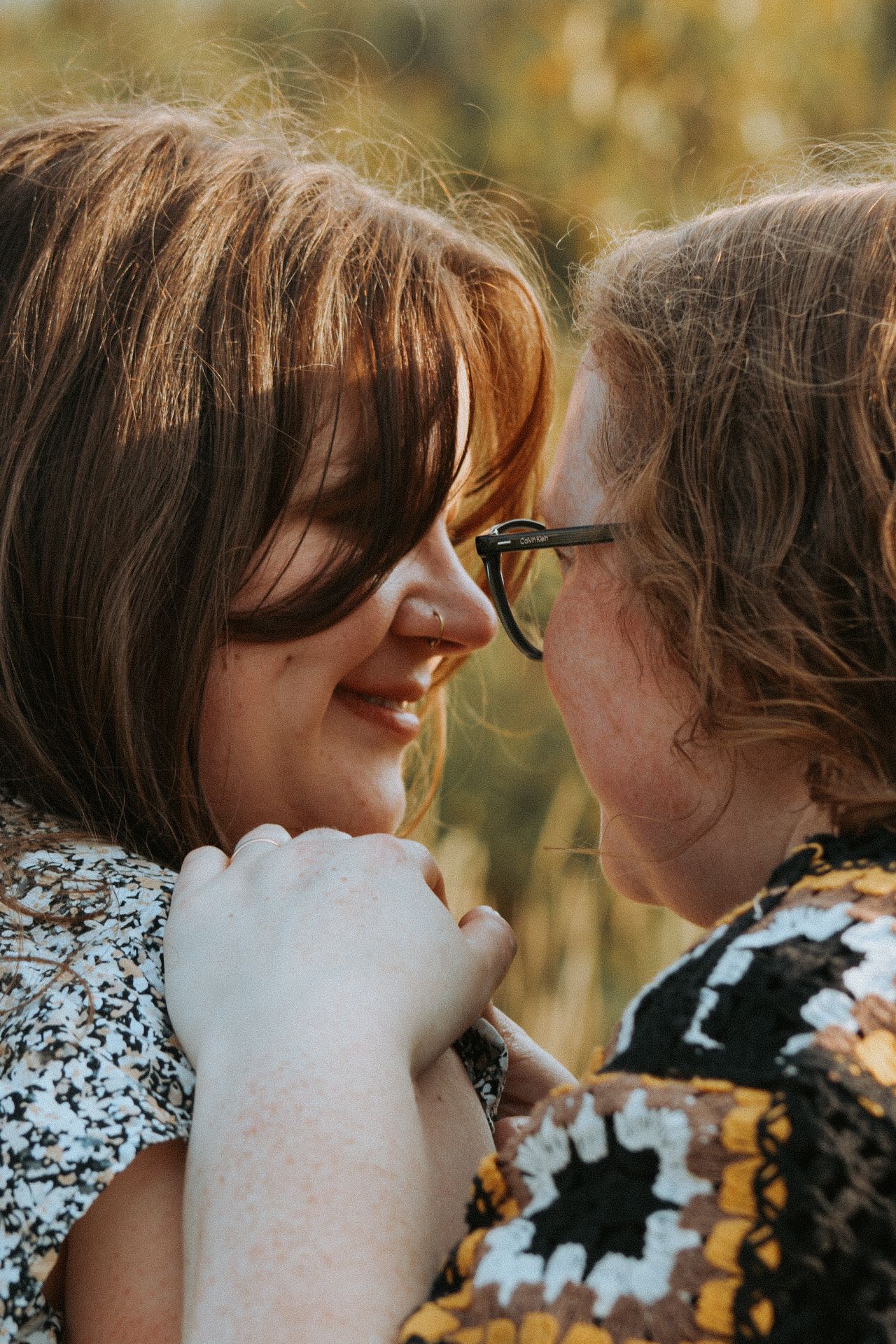 A romantic autumn engagement photo shoot with soft natural lighting.