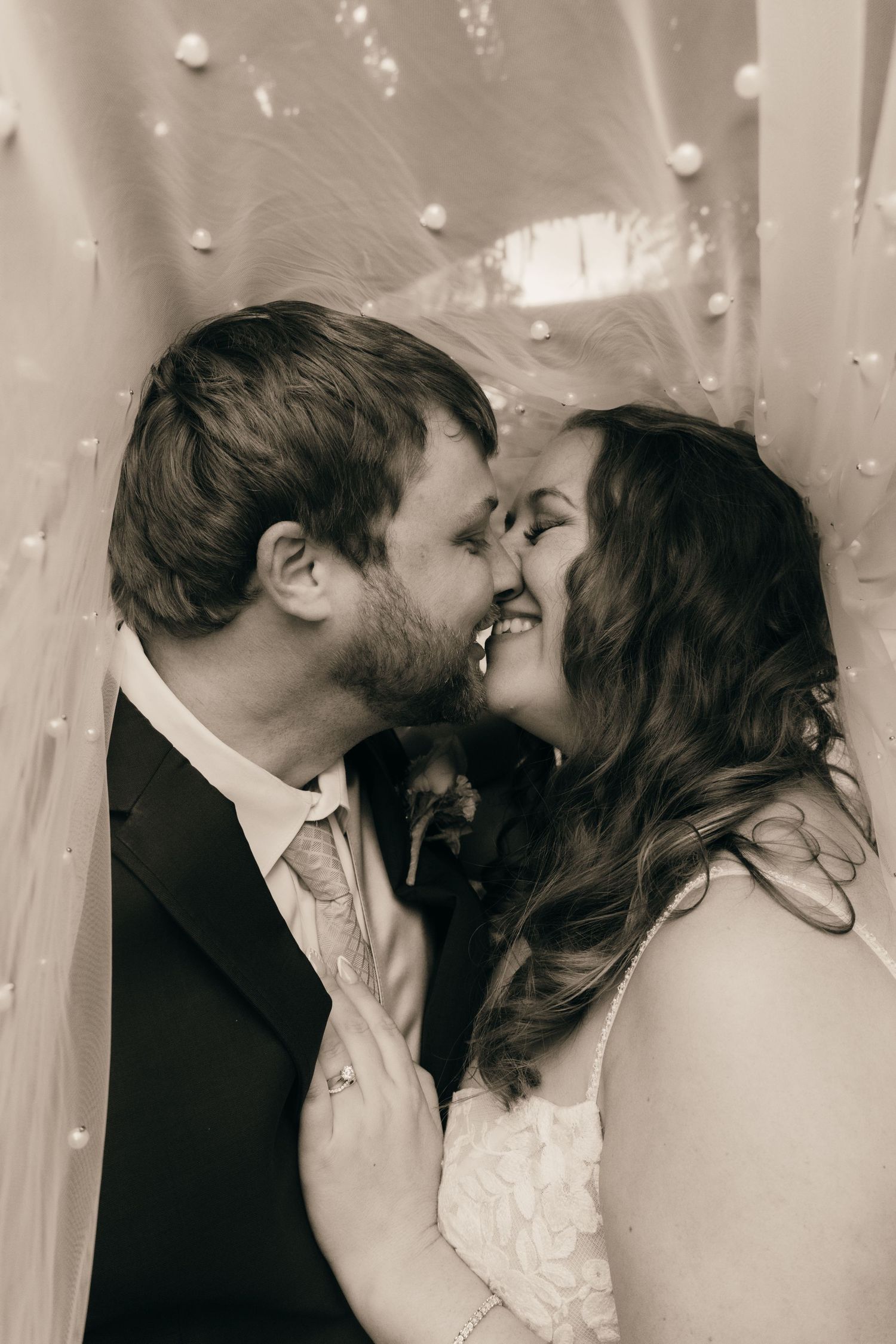 A sepia-toned romantic portrait sequence of a wedding couple's intimate moments.