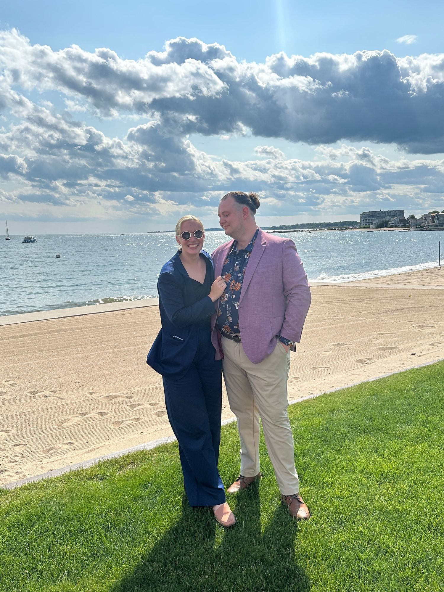 New England wedding and event photographer Dan Bowler and queer, non-binary partner at Connecticut wedding with a coastal beach setting