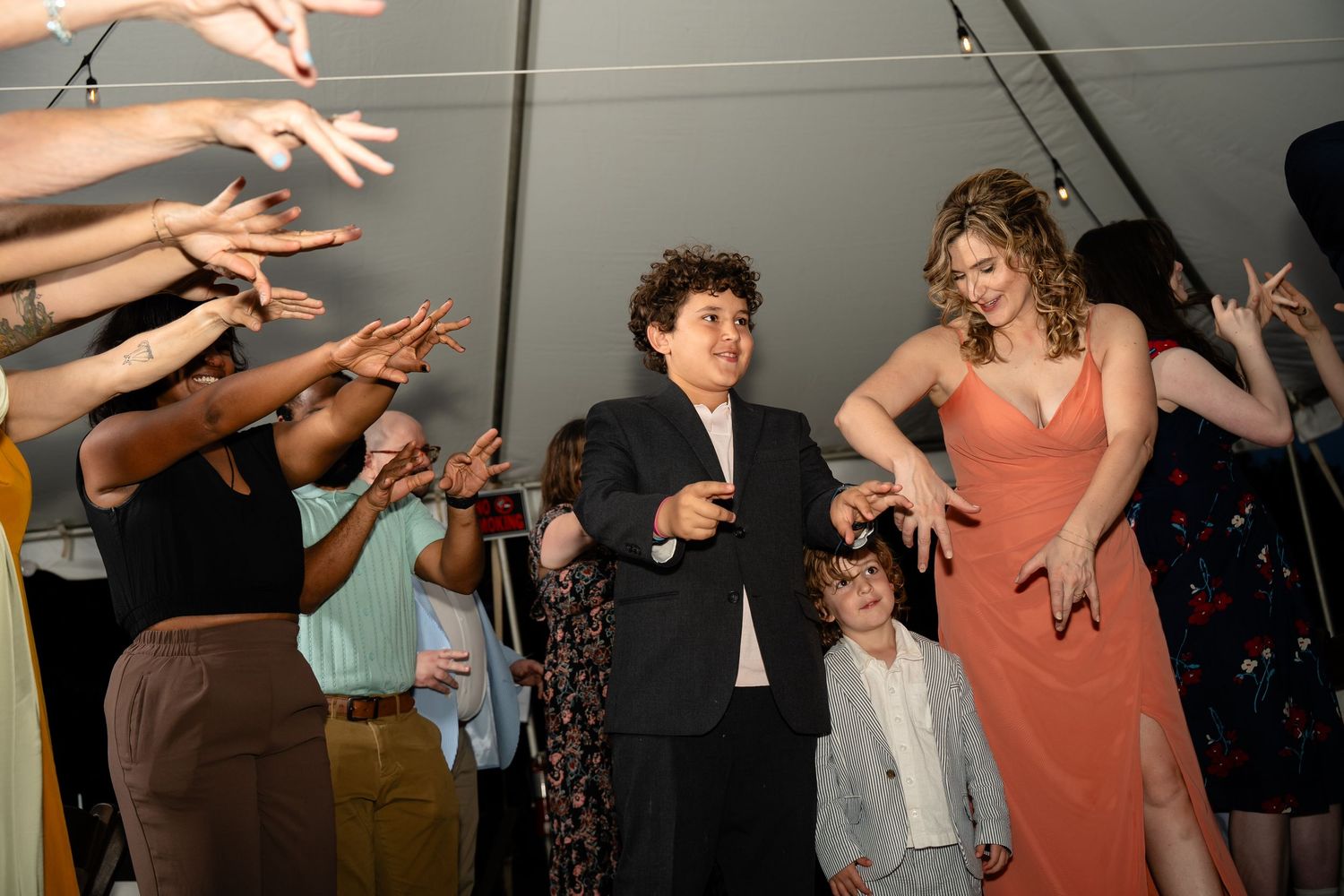 Bride's nephews dance with their mother during the party of a wedding on Church Hill in Richmond Virginia