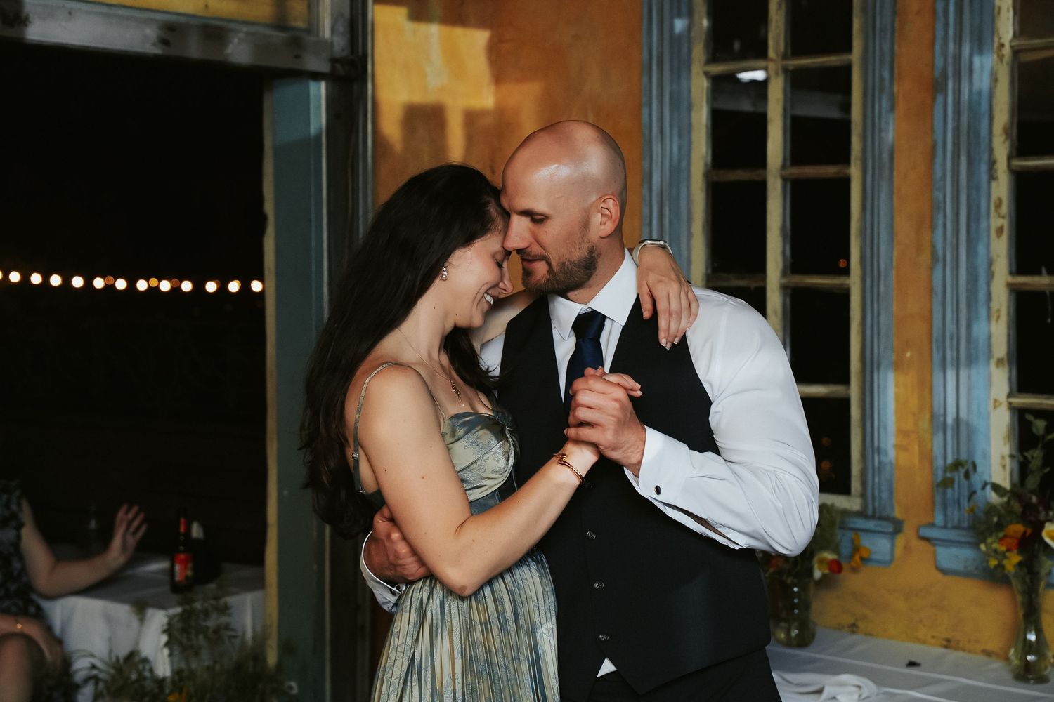 Groomsmen and his girlfriend sway on the dancefloor of Havana 59 wedding venue in Richmond Virginia