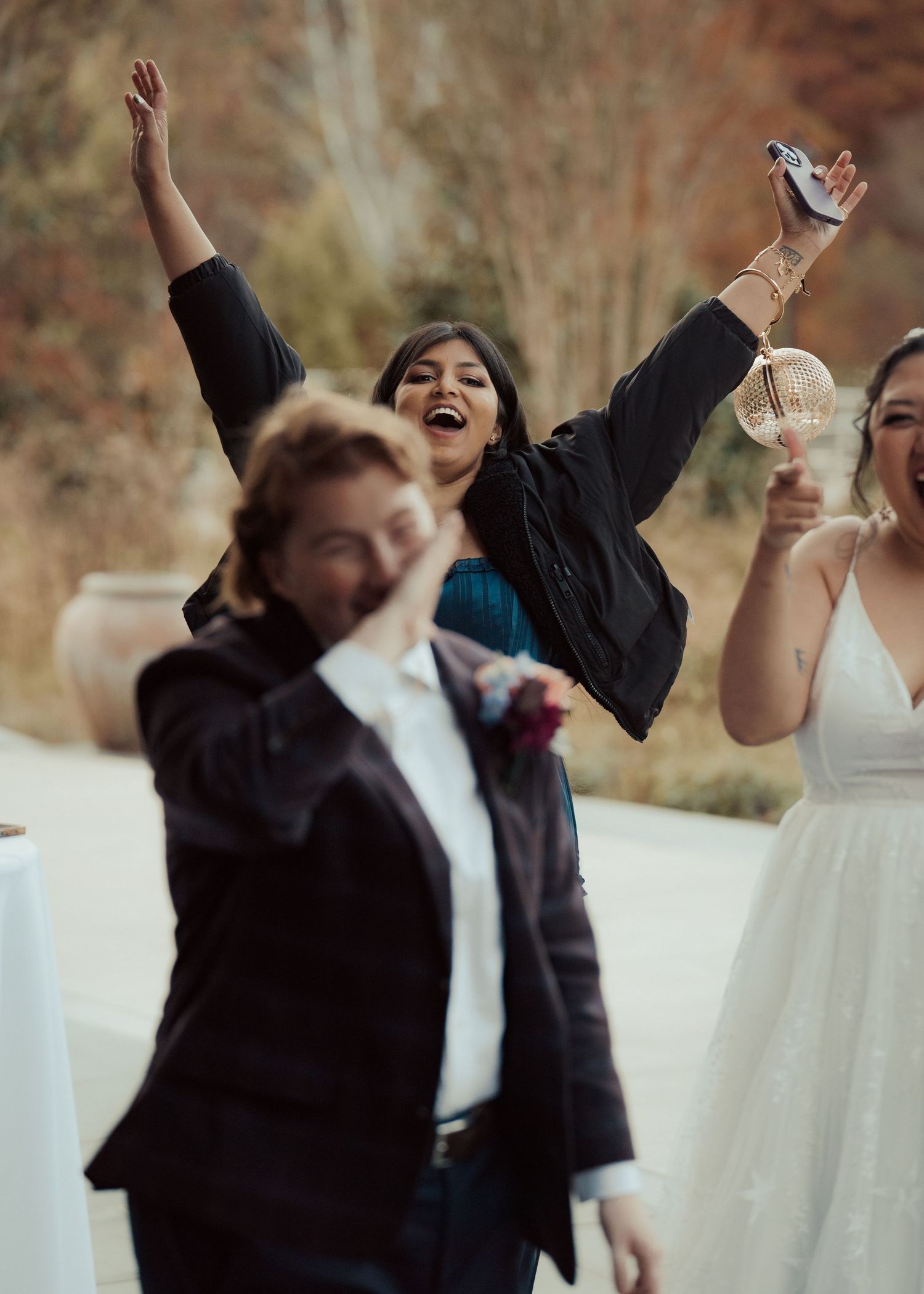 Wedding guest reacts to a queer groom discovering a surprise that has been left for them during cocktail hour at a LGBTQ wedding in Maryland
