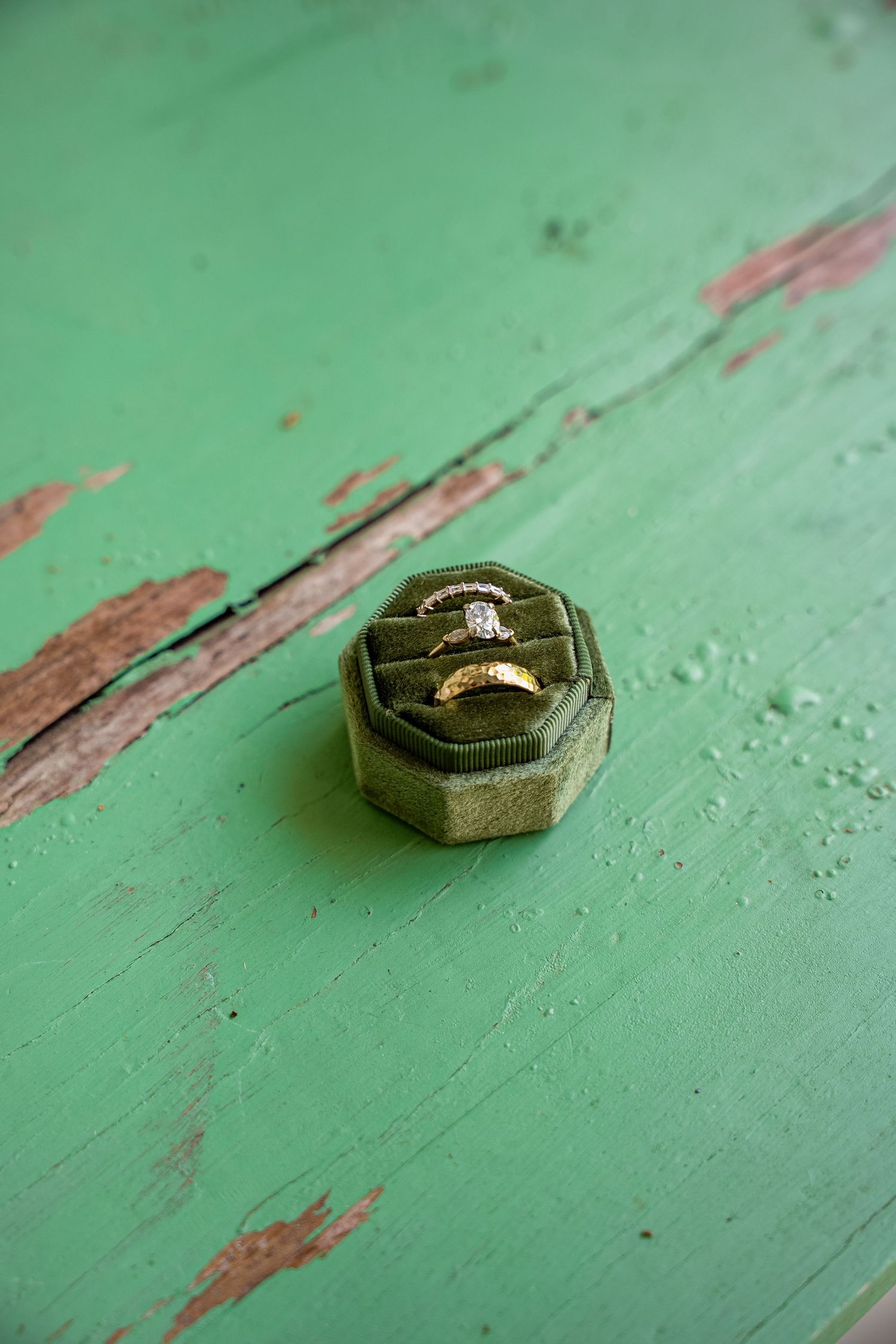 Fine art detail photograph of wedding bands and engagement ring by documentary style wedding photographer