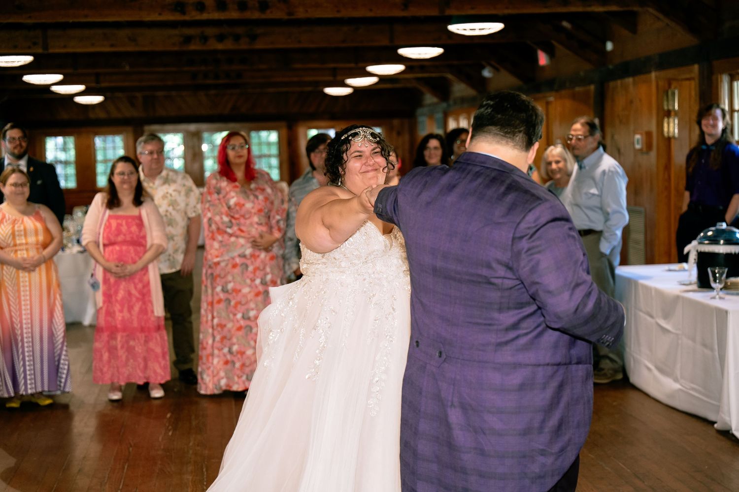Bride and groom share their first dance in the banquet hall of Pocahontas State Park