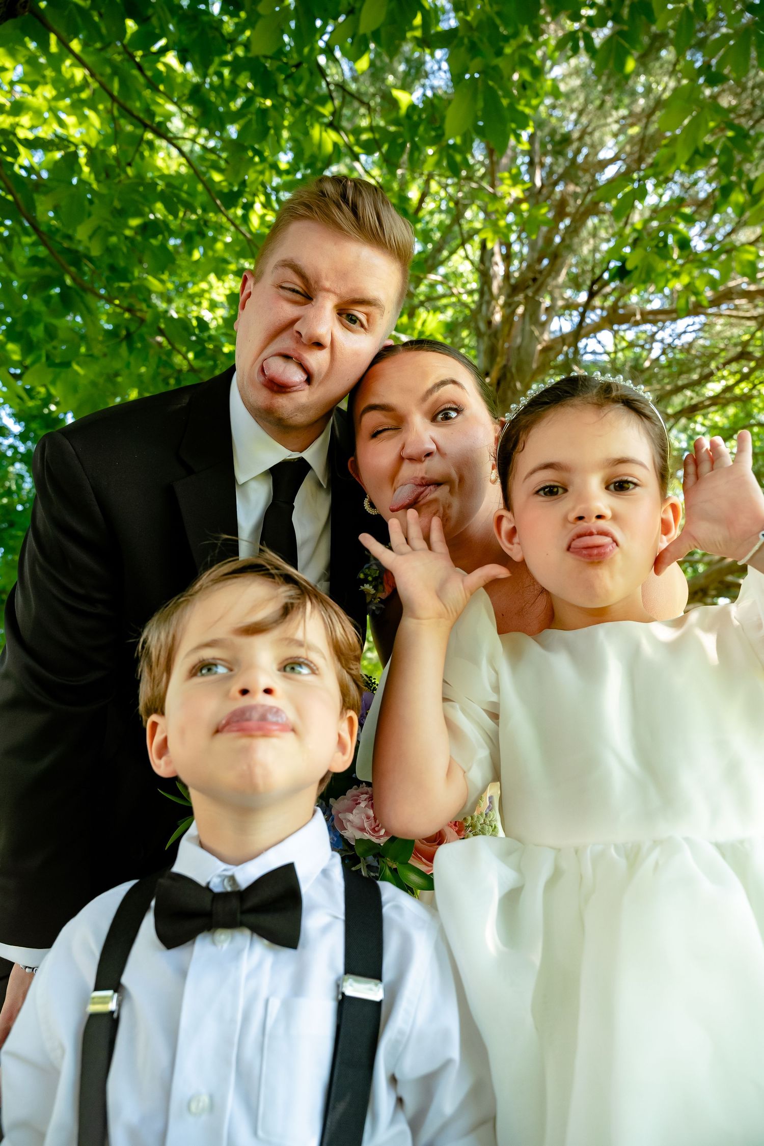 Bride and Groom make silly faces with the bride's niece and nephew before their wedding ceremony at Avonlea Farms outside Richmond Virginia