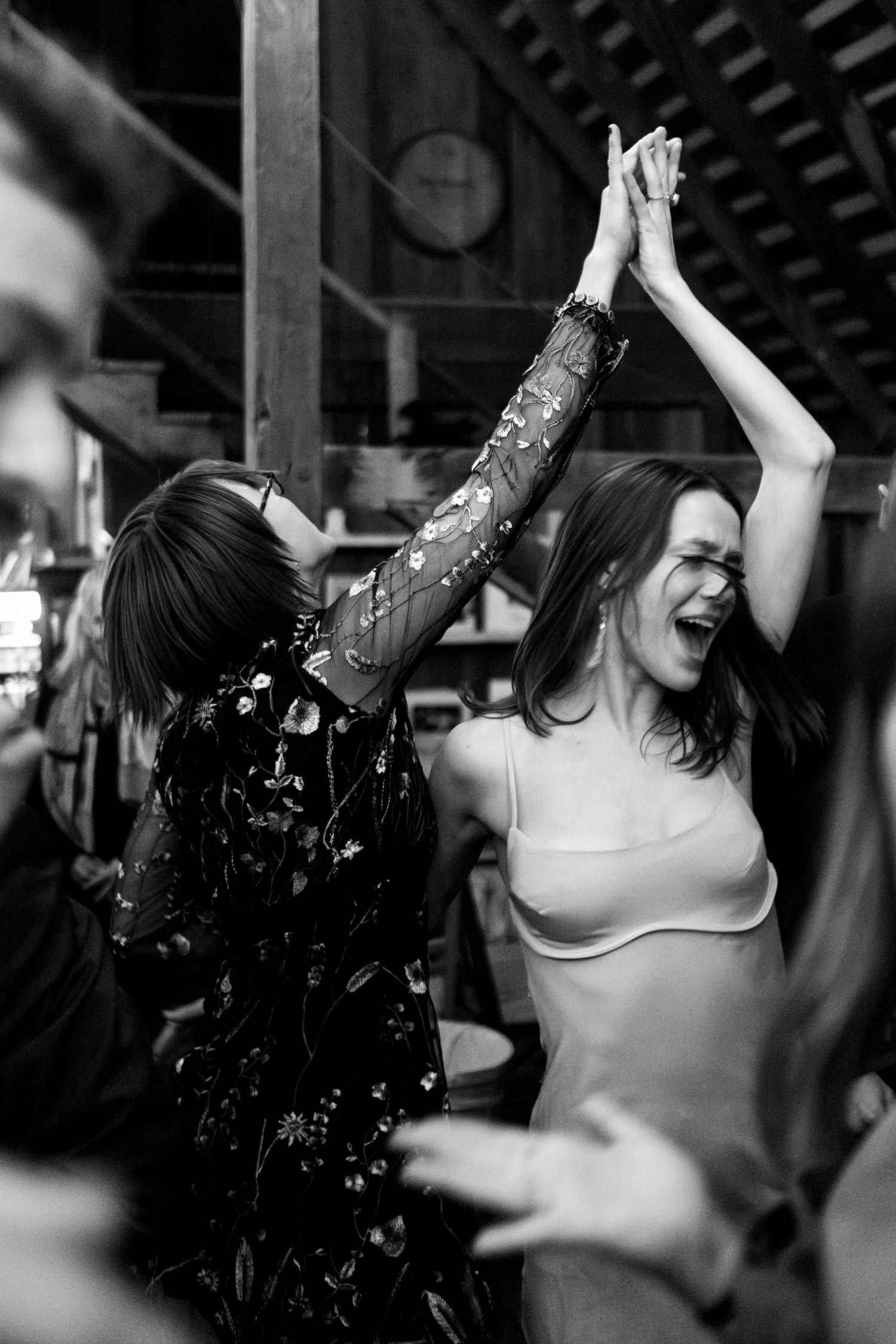 Wedding guest turns family member on dancefloor in black and white photograph at Northern Virginia wedding