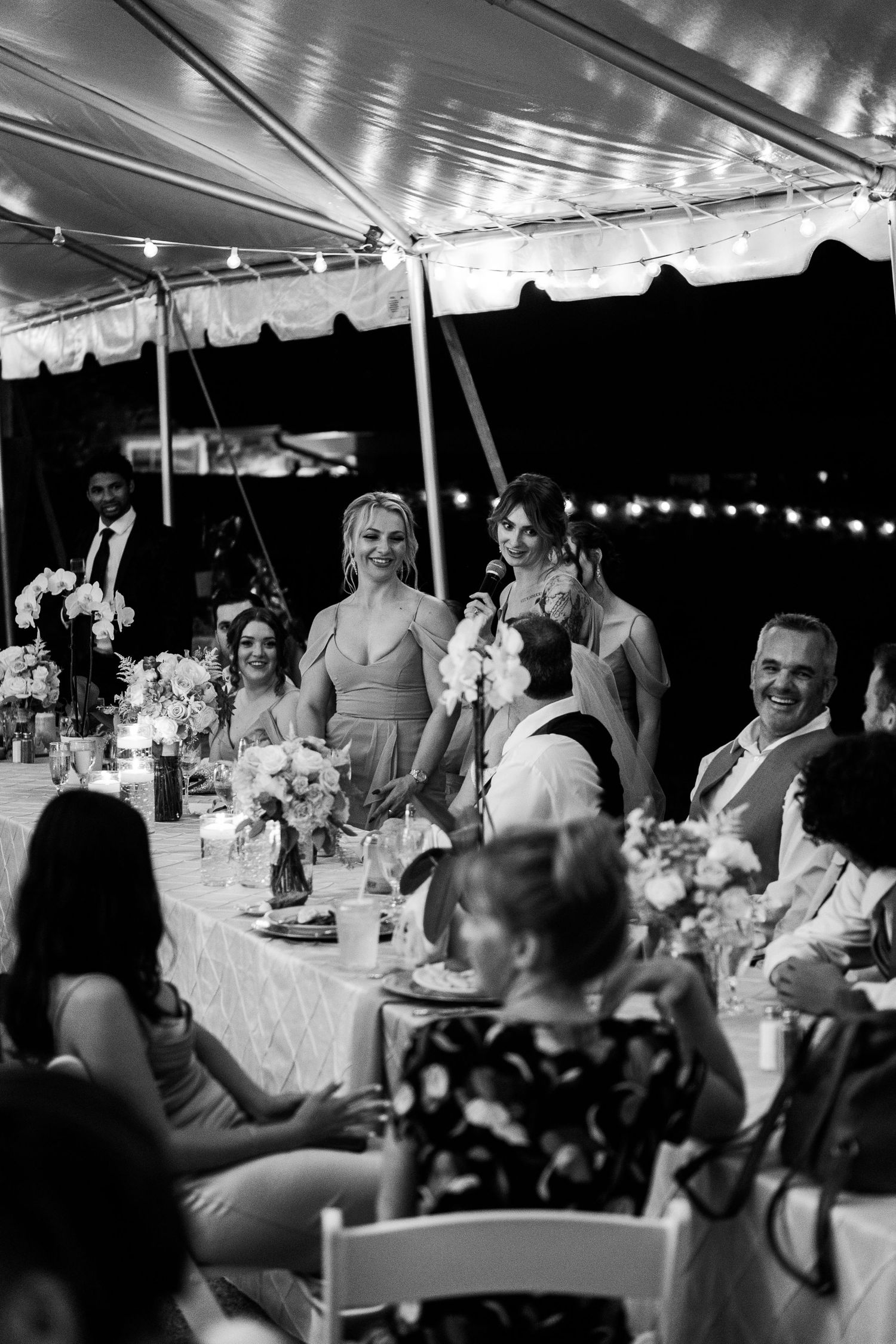 Two daughters offer a wedding toast to their mother at a wedding venue in Northern Virginia
