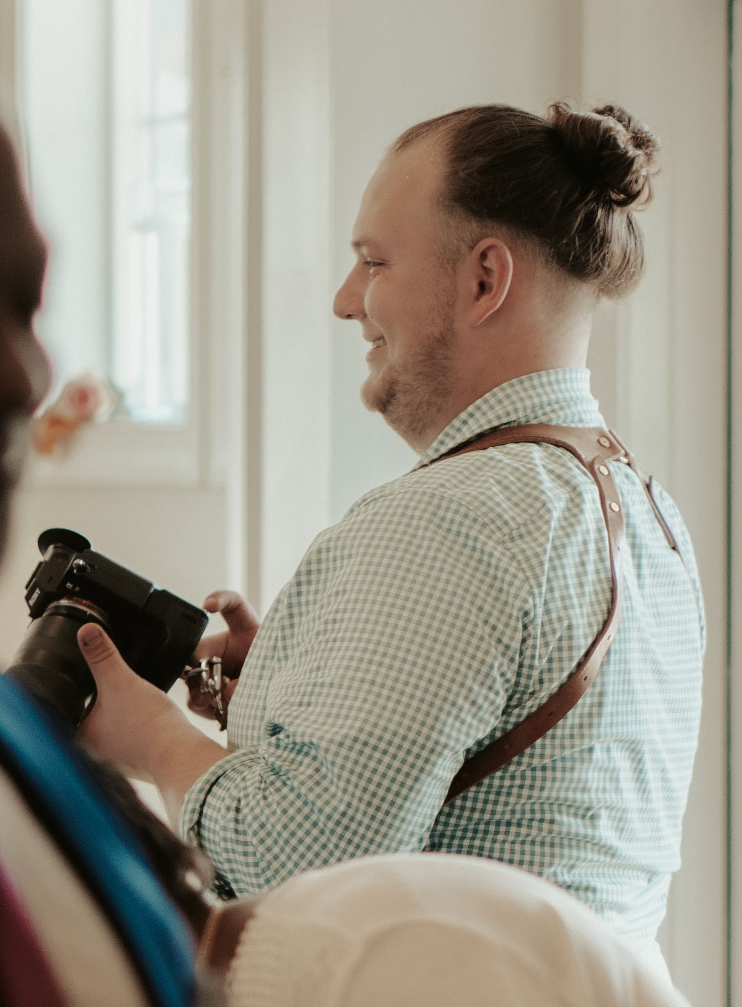 Documentary Style New England Wedding Photographer Dan Bowler works on an LGBTQ wedding