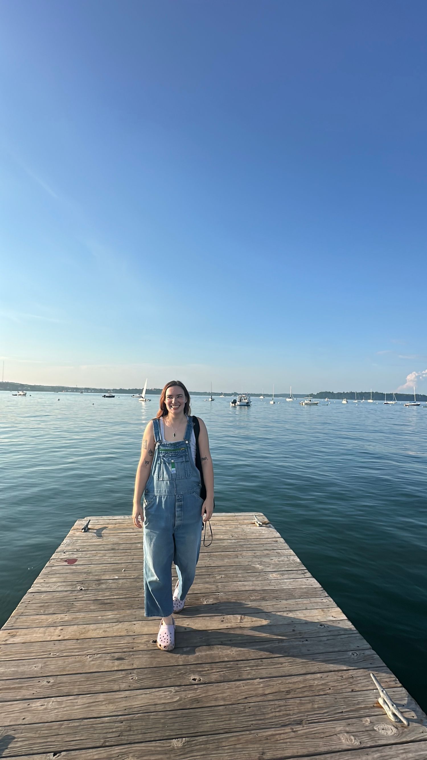 New England wedding and event photographer Dan Bowler's non-binary partner after move to Portland Maine visiting Casco Bay