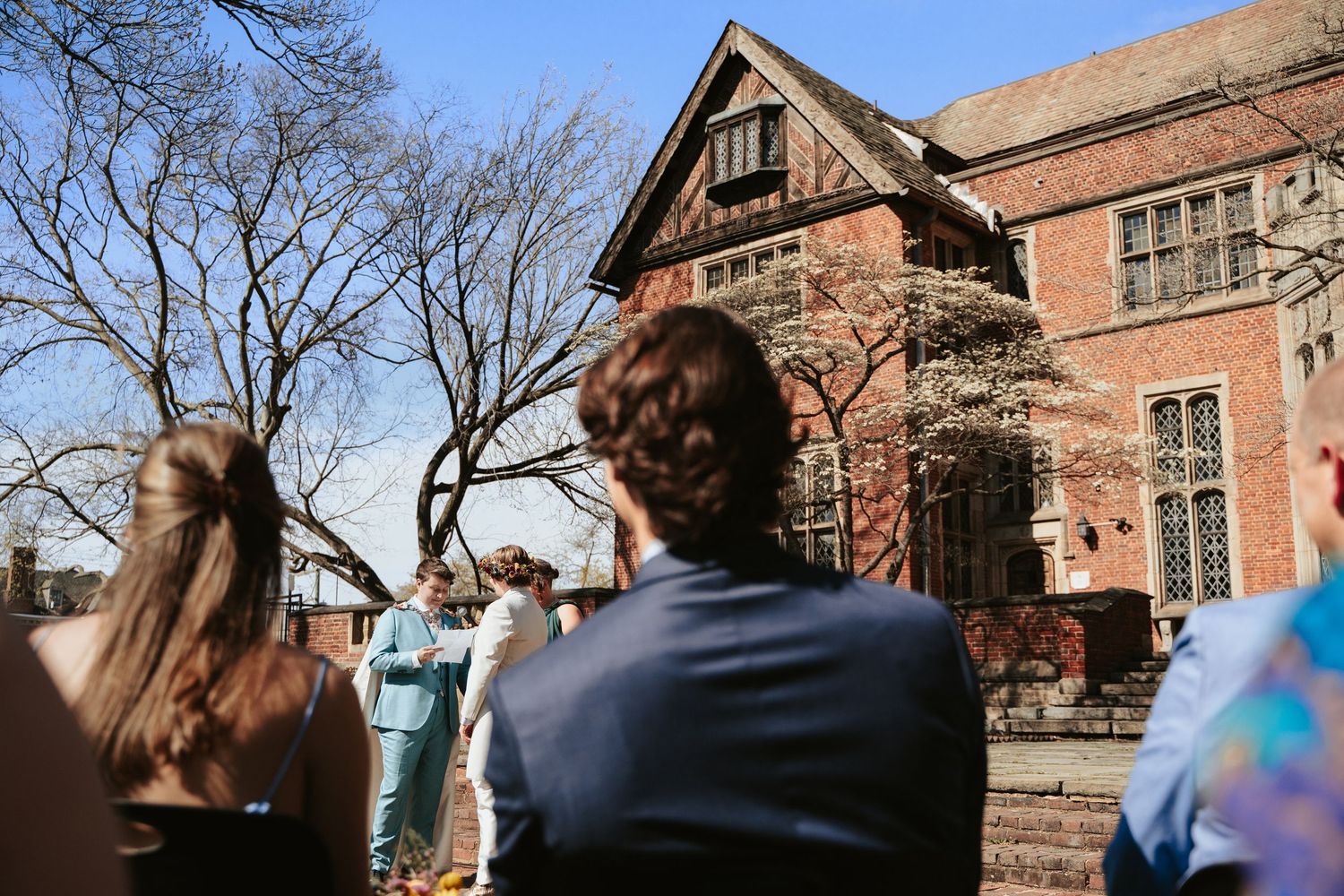 Dark academia LGBTQ wedding of two brides in romantic manor wedding at The Branch Museum in Richmond Virginia