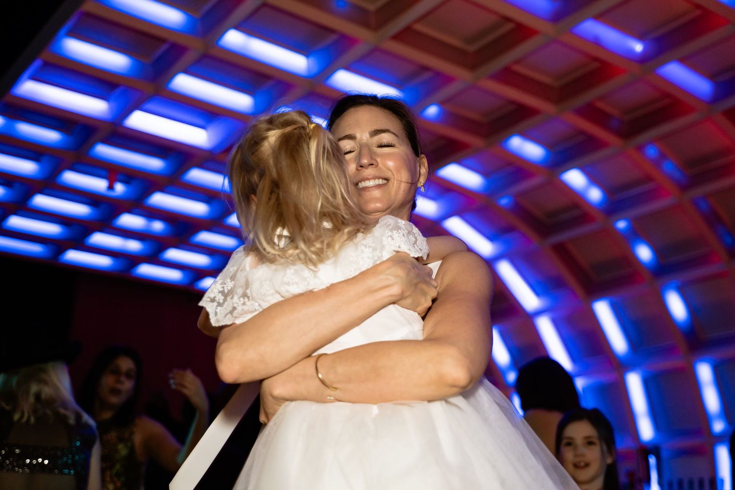 Bride swings around her niece on the dancefloor of her modern chic wedding at the Hotel Washington in Washington DC