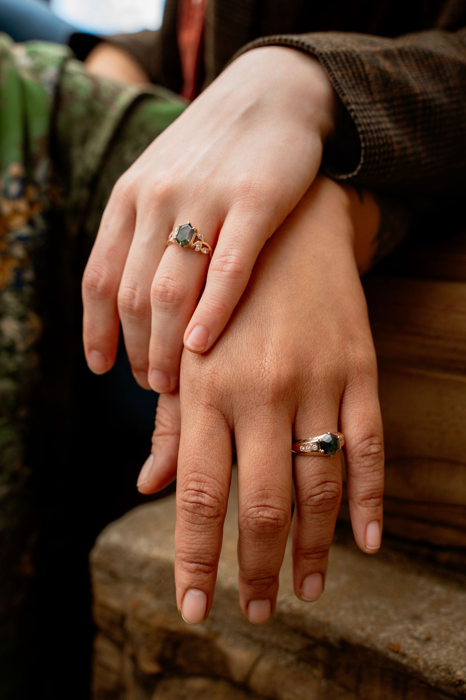 LGBT couple posed hands with unique stone rings in engagement photo session with LGBT photographer