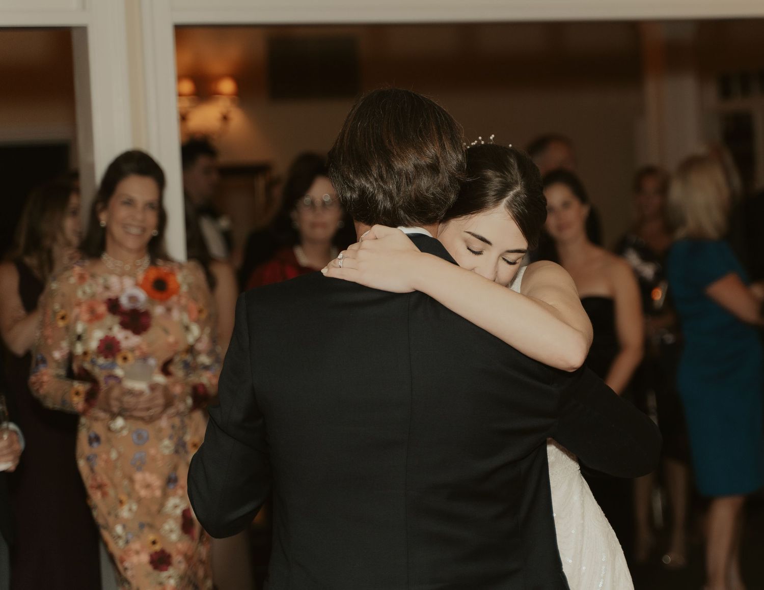 Bride embraces her father during their father-daughter dance at The Mill at Fine Creek.