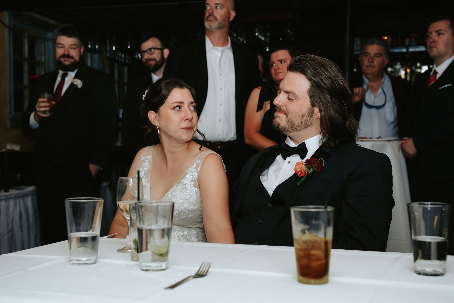 Emotional bride and groom exchange a knowing look during the bride's sister's touching toast at Havana 59