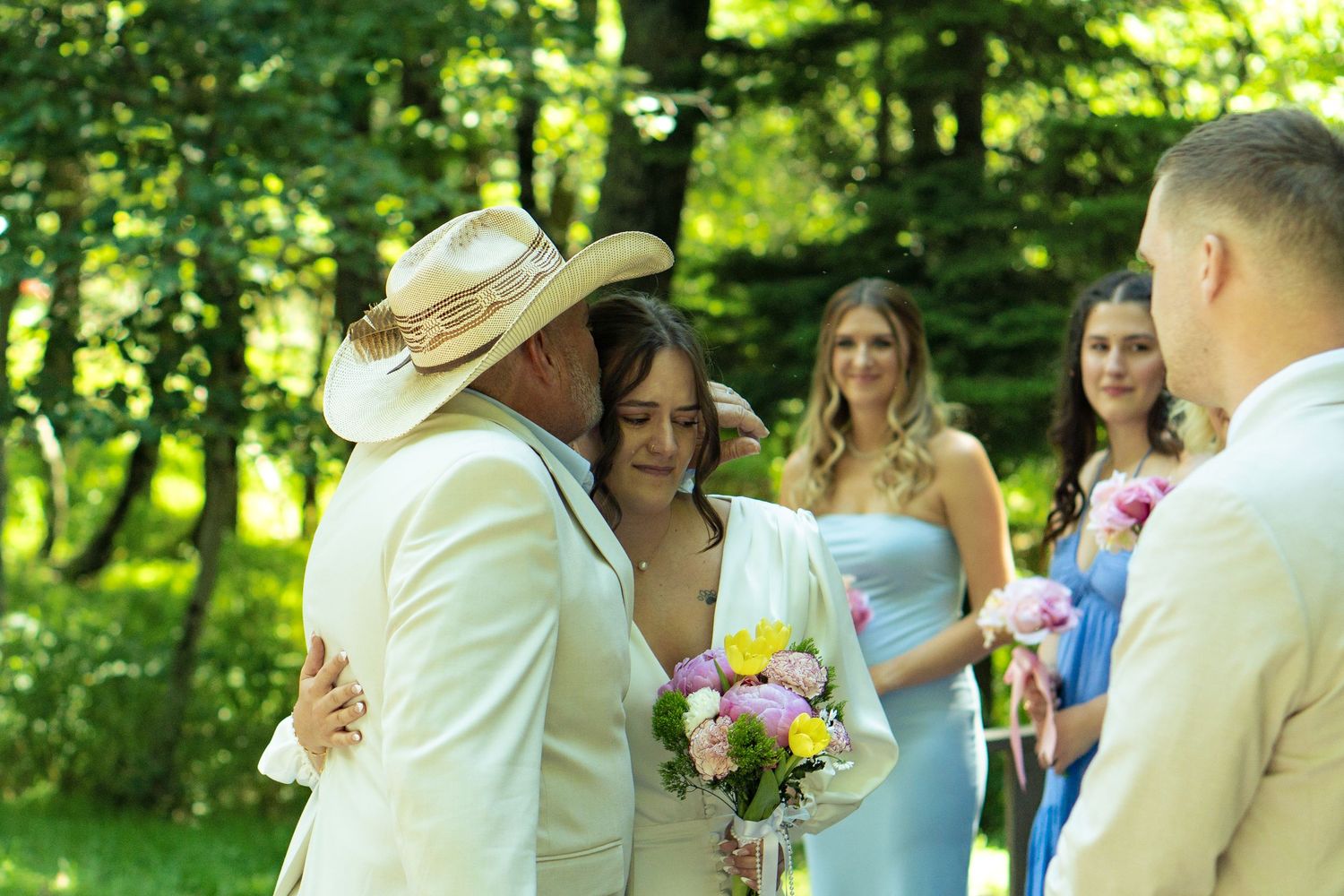 Bride is kissed on the head while given away by her father on mountaintop elopement in Skyline Drive Virginia