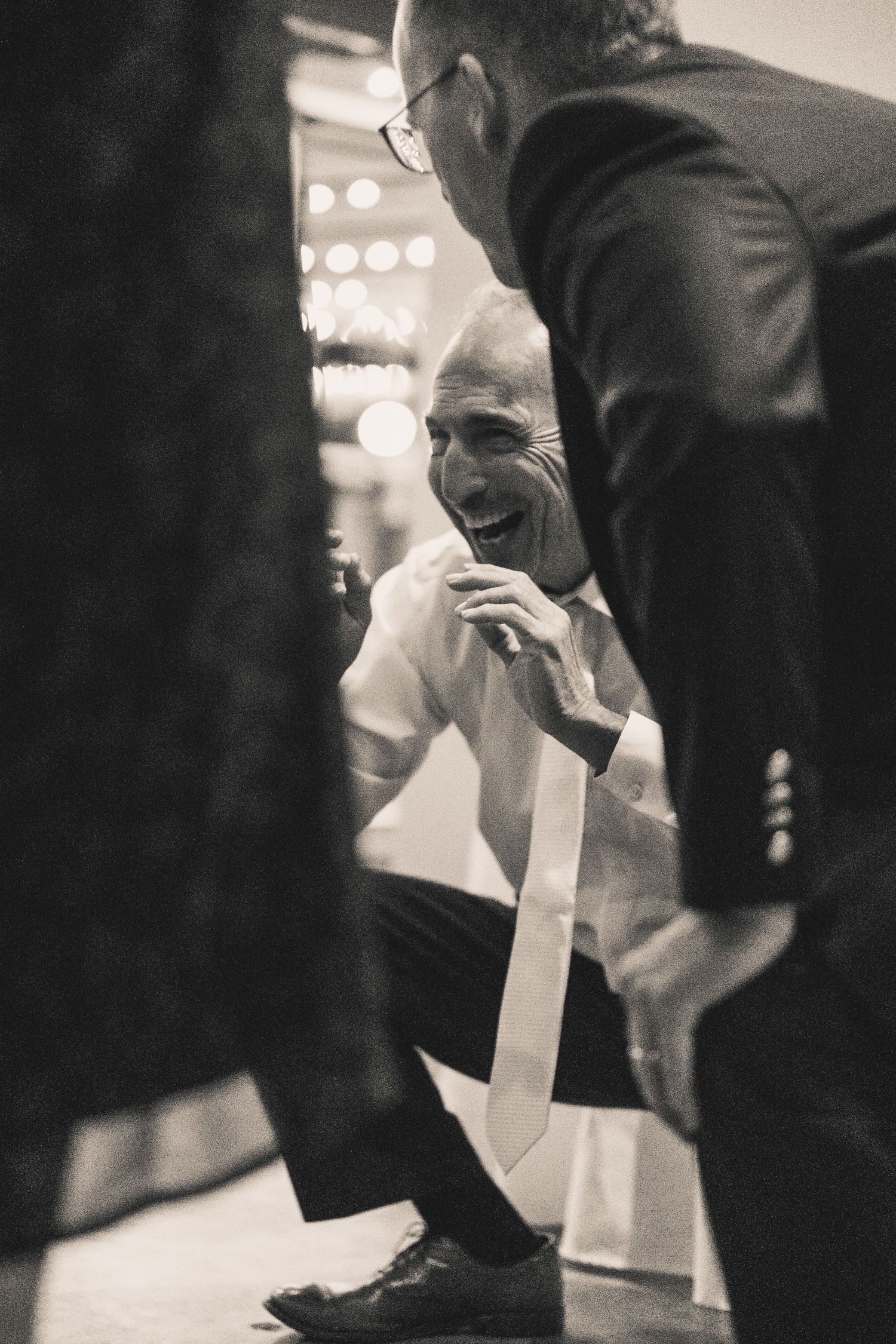 Father of a bride gets low on the dancefloor in a documentary style wedding at a venue in Richmond Virginia