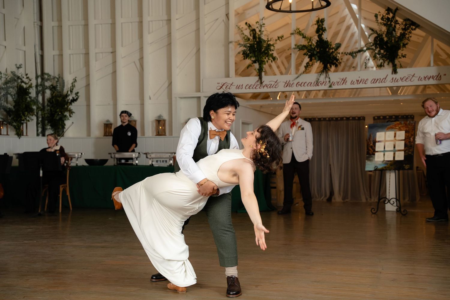 Shenandoah Virginia bride dips her bride during their first dance at Valley Road Vineyards