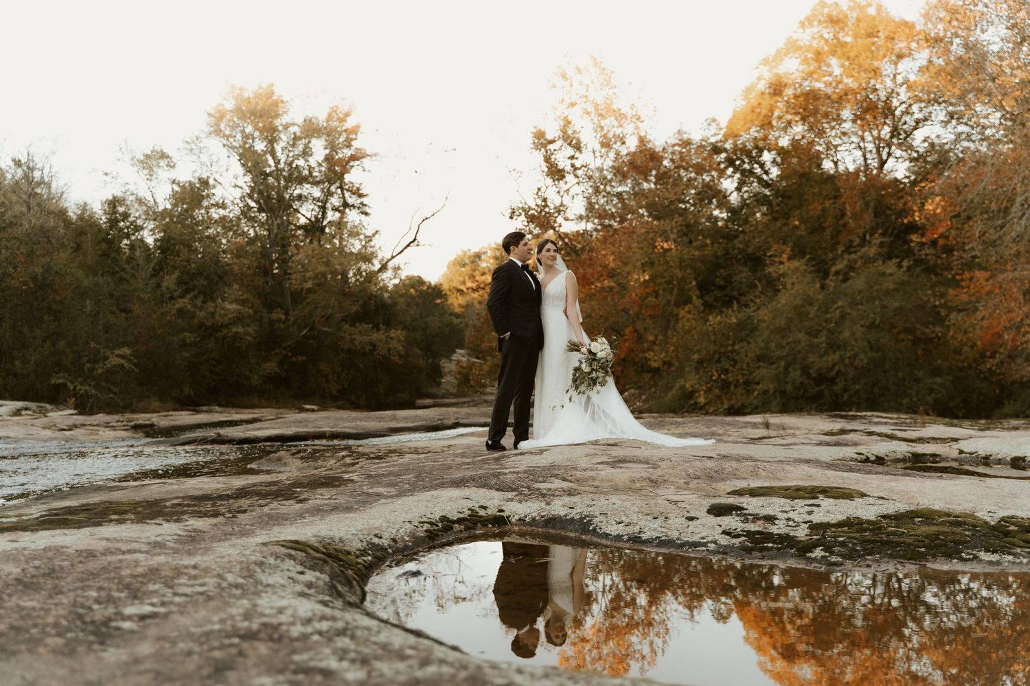 Fall foliage and reflections in the water frame a stunning couple in this classic Virginia wedding with a natural aesthetic