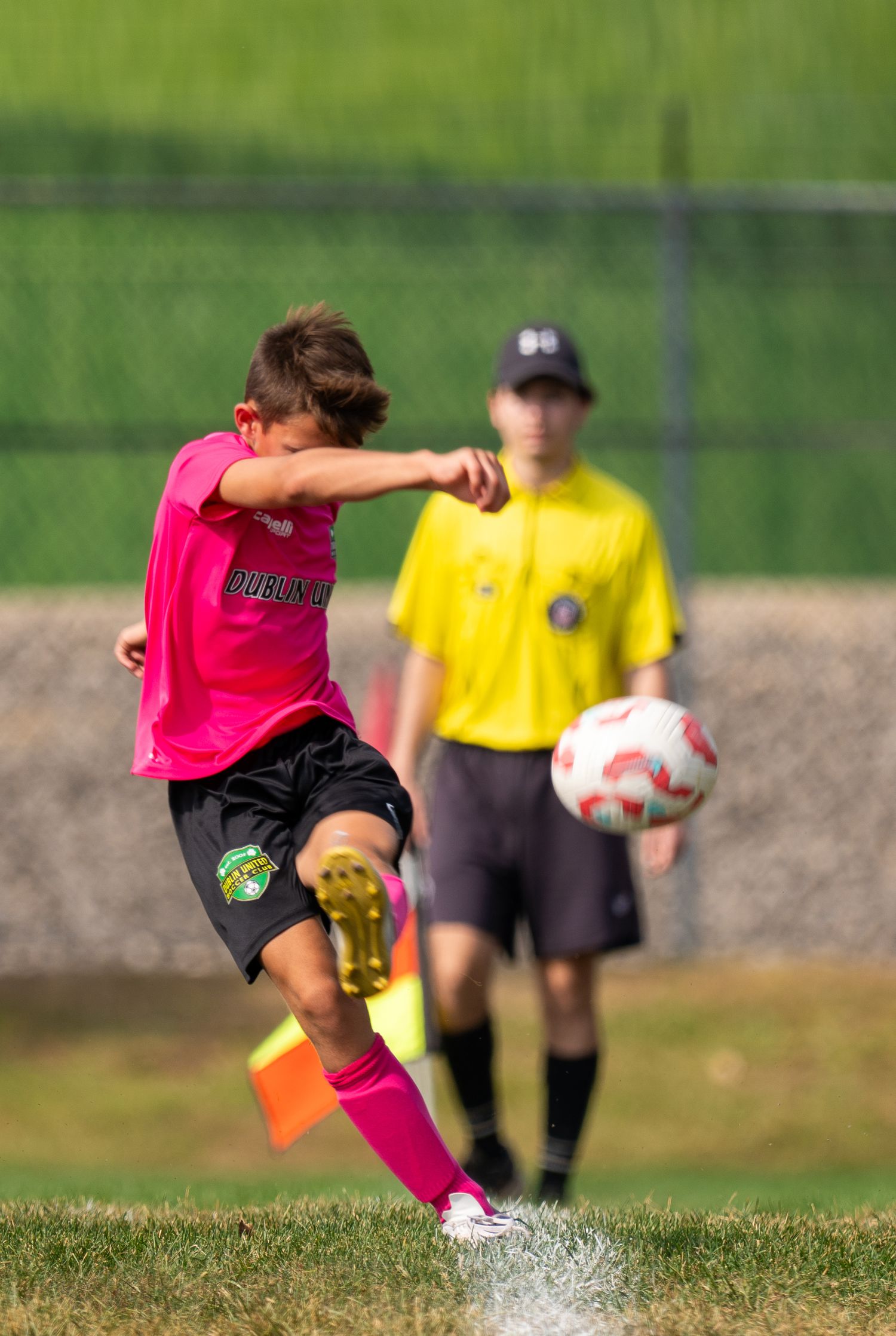 soccer player taking a corner kick