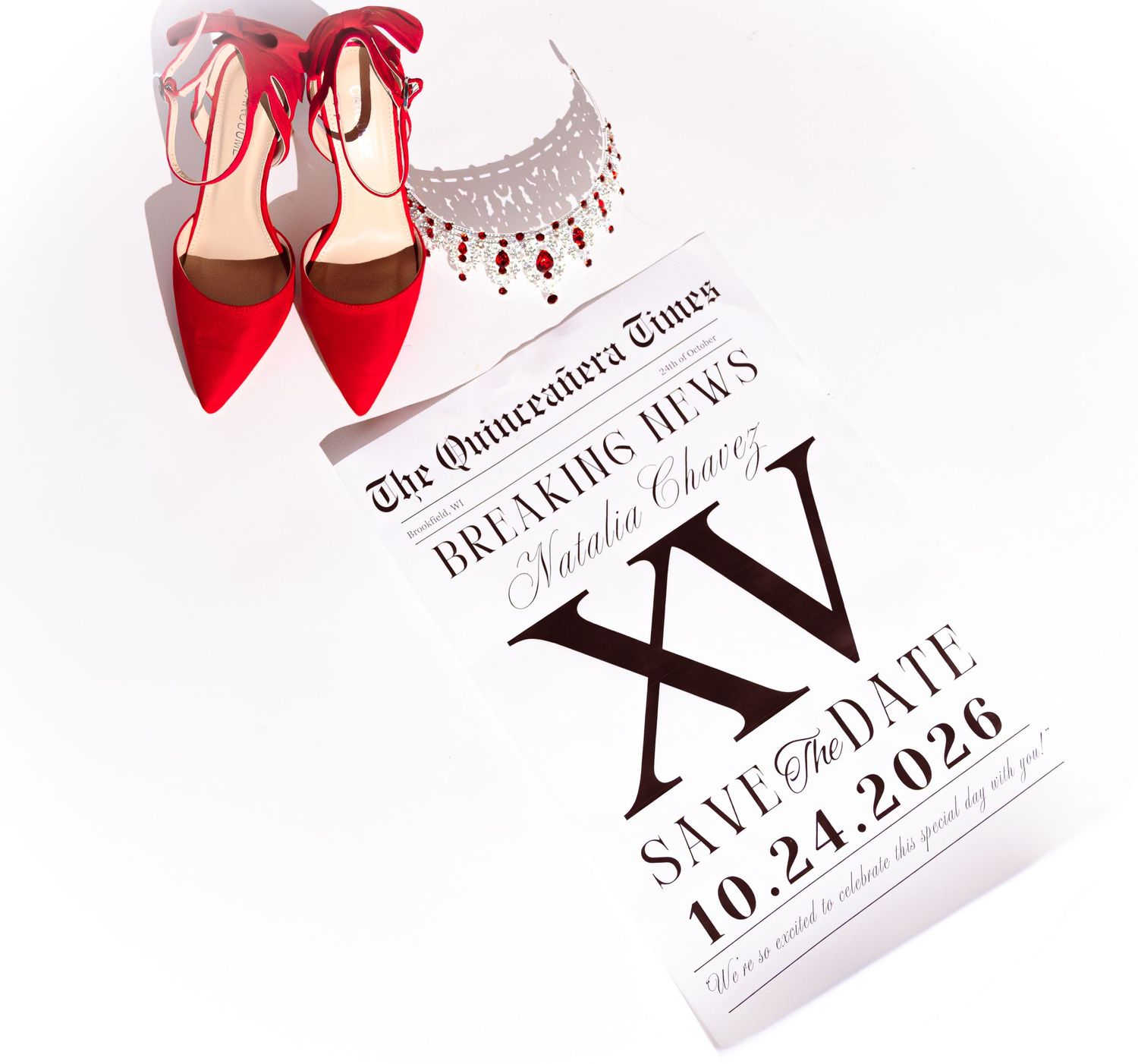 Quinceañera save the date card with red heels and jewelry, reading The Quinceañera Times Breaking News, dated 10.24.2026.