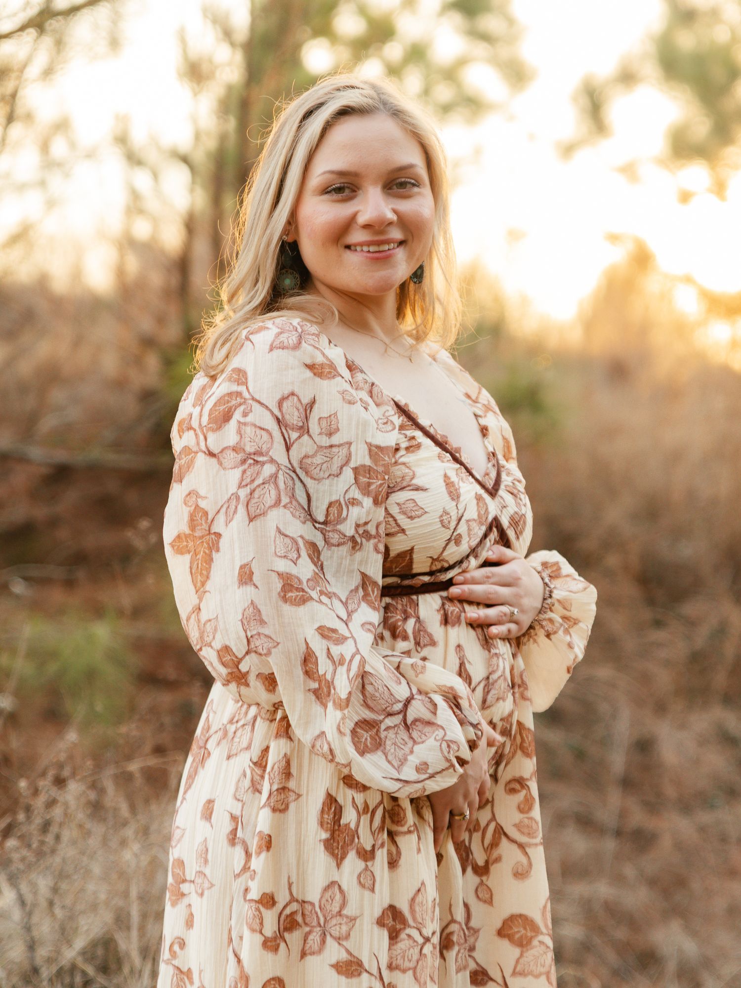 A floral maxi dress with brown and cream floral print is shown in a series of outdoor photos at sunset.