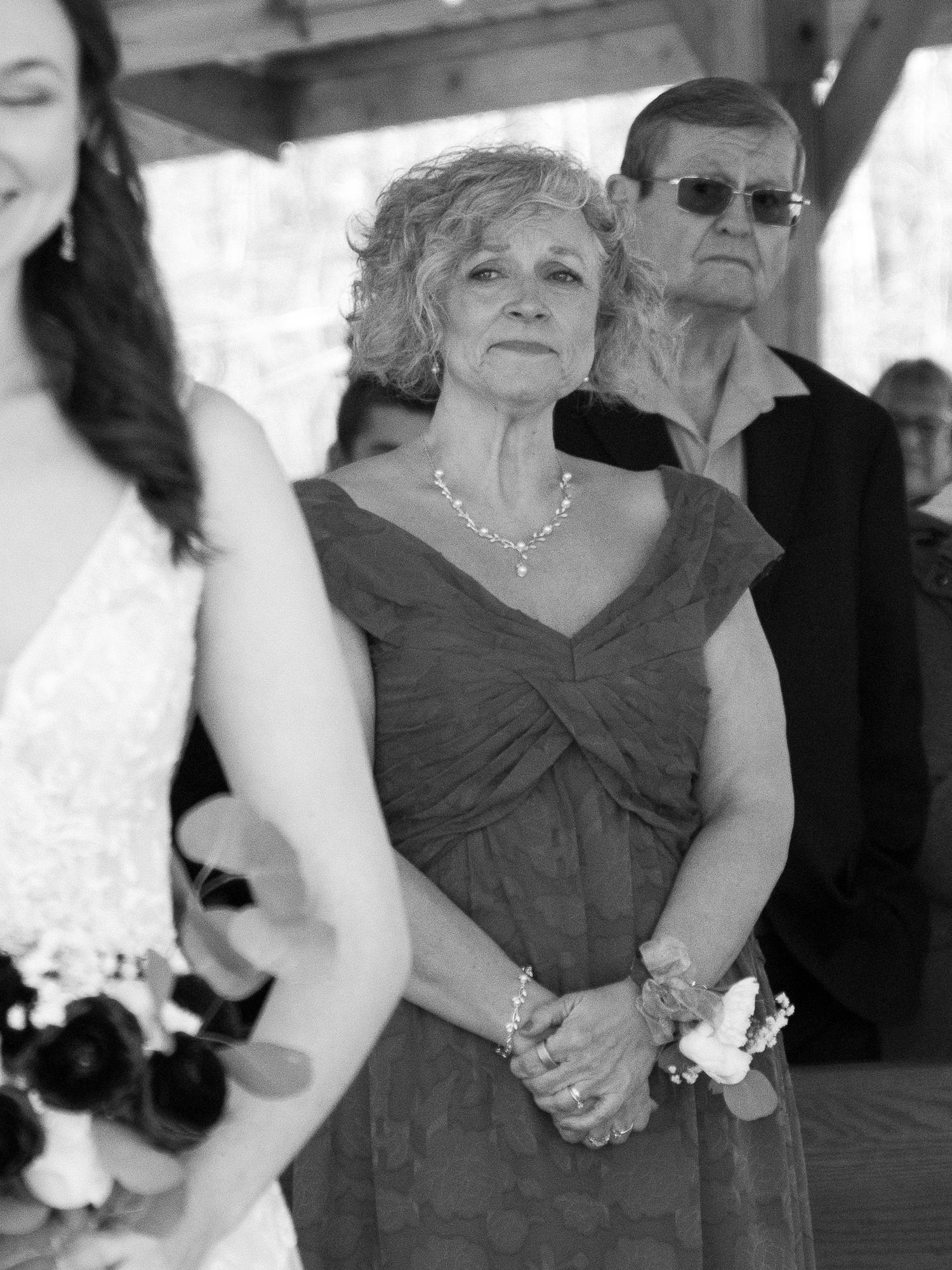 Black and white photo of a woman becoming emotional while watching a wedding ceremony in Batesburg, South Carolina.