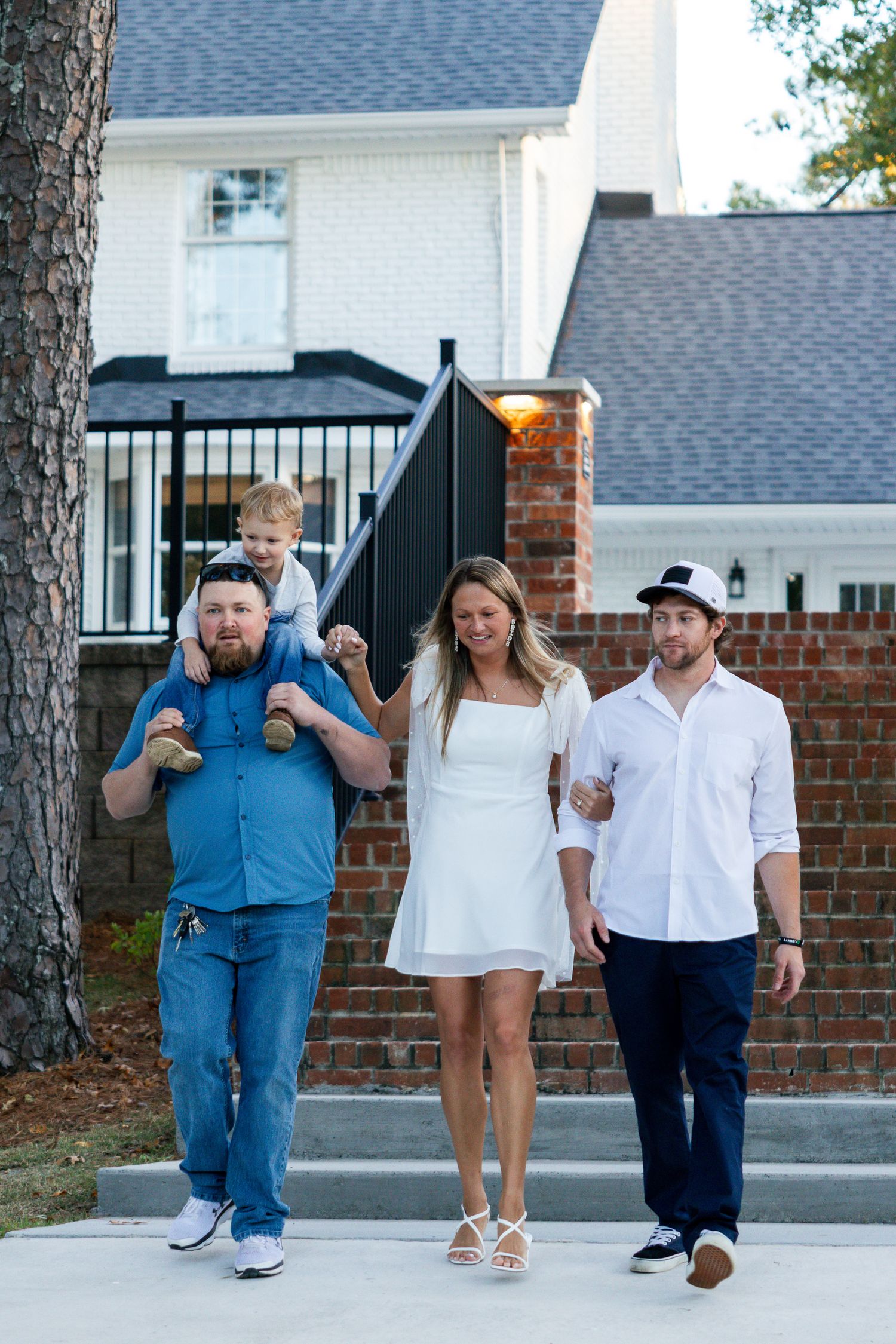 Three people walking together on a brick path, shown in a sequence of four connected photos.