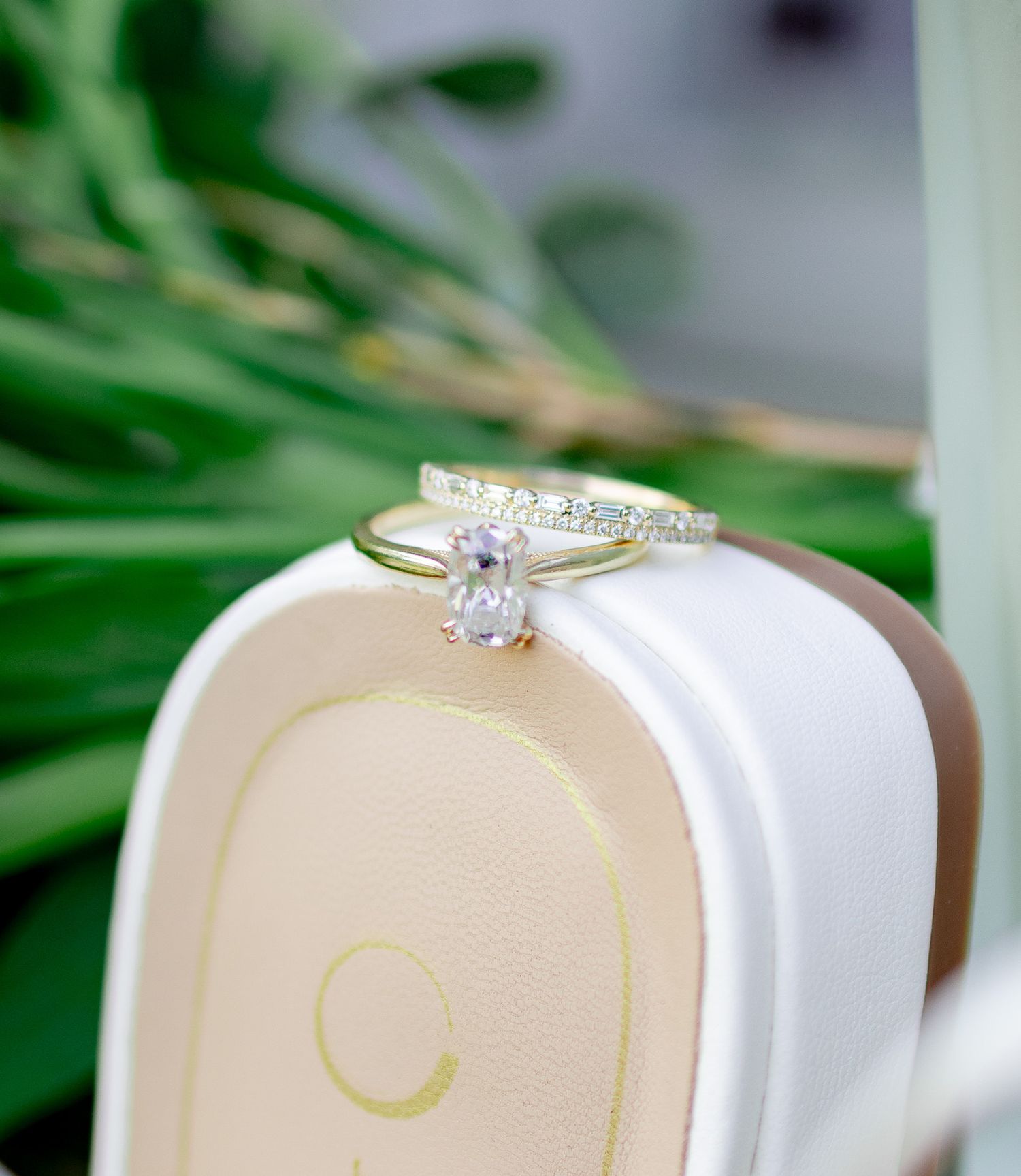 Gold engagement ring with an oval diamond and pavé band displayed in a ring box during a Gilbert, South Carolina engagement session.