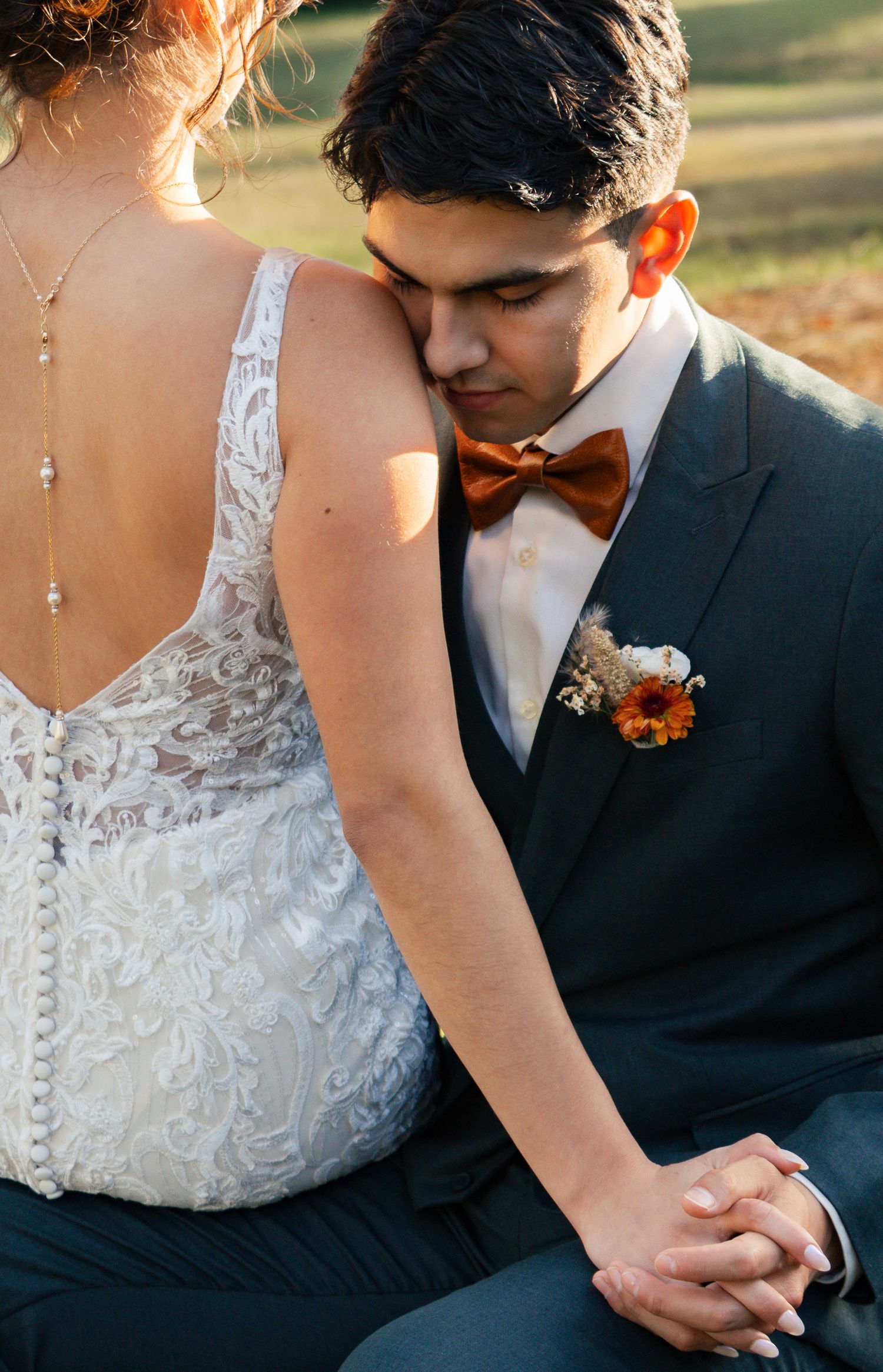 A romantic close-up sequence shows a couple in wedding attire holding hands during sunset. South Carolina Wedding Photographer