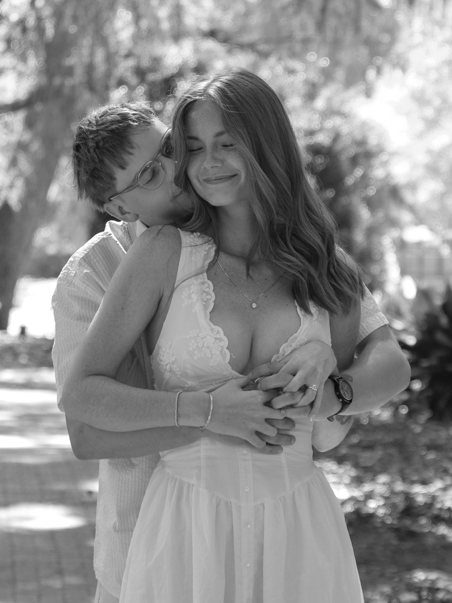 Black and white portrait of an engaged couple embracing during an Aiken, South Carolina engagement session.