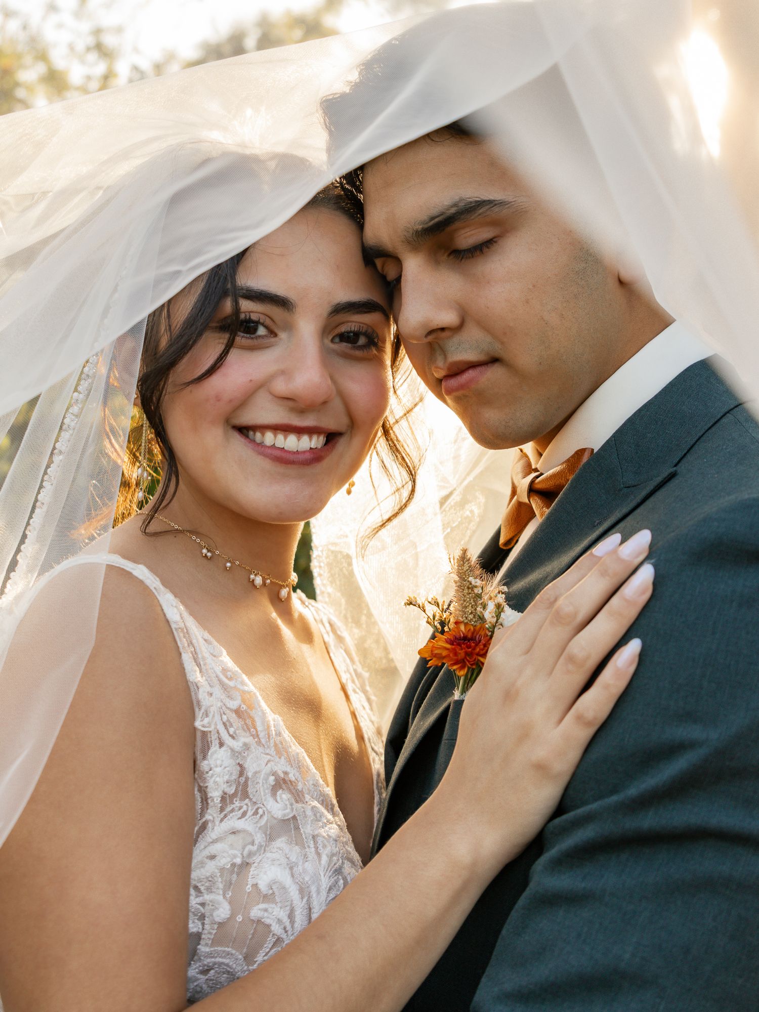 A romantic series of wedding photos showing a couple embracing in warm sunlight with the bride wearing a lace dress. South Carolina Wedding