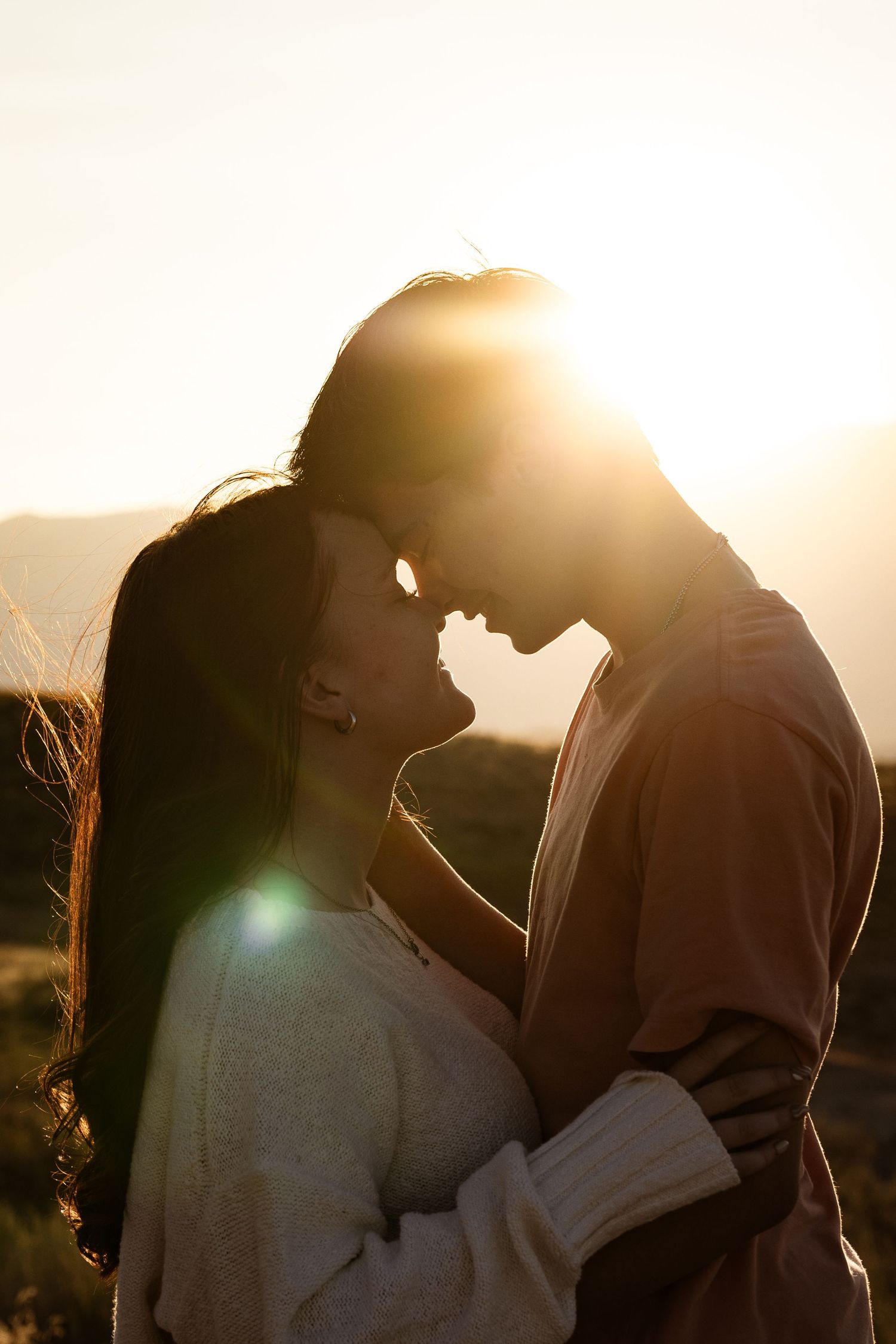 Romantic couples portrait at sunset in Utah County.