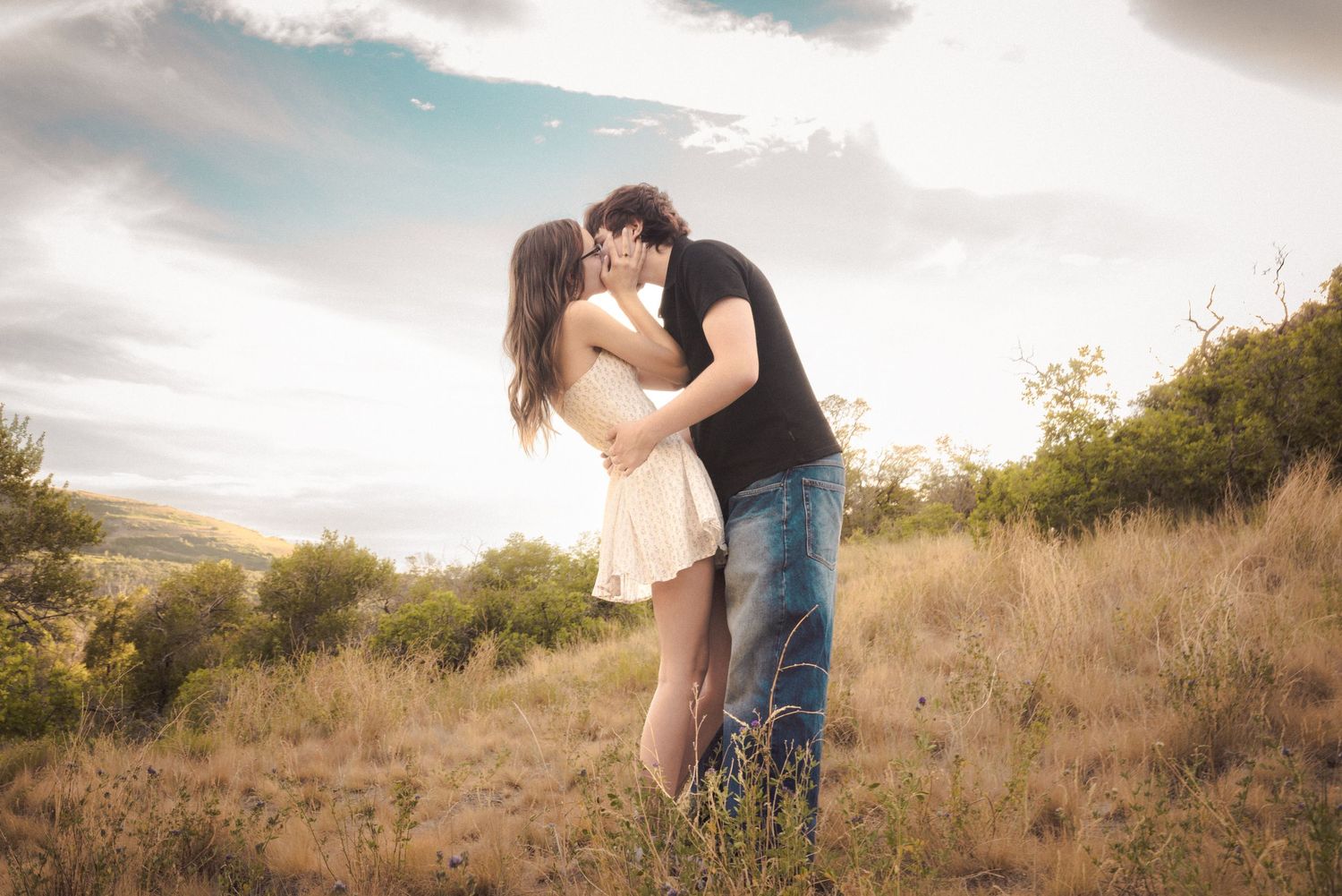 Artistic couples session with dramatic sunset in Utah.
