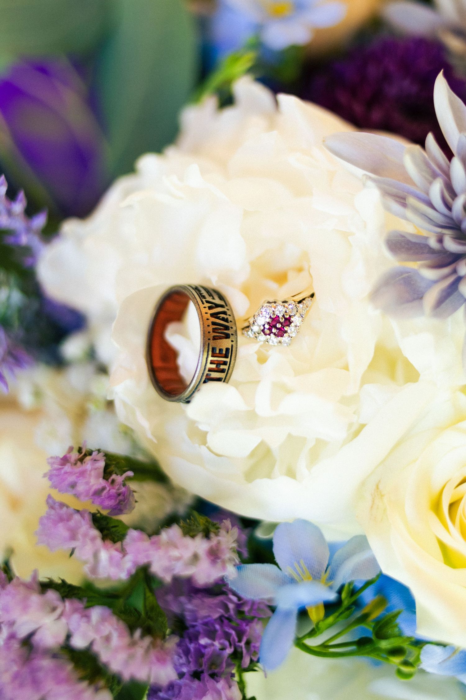 Detail shot of wedding rings and bouquet at a Utah County wedding.