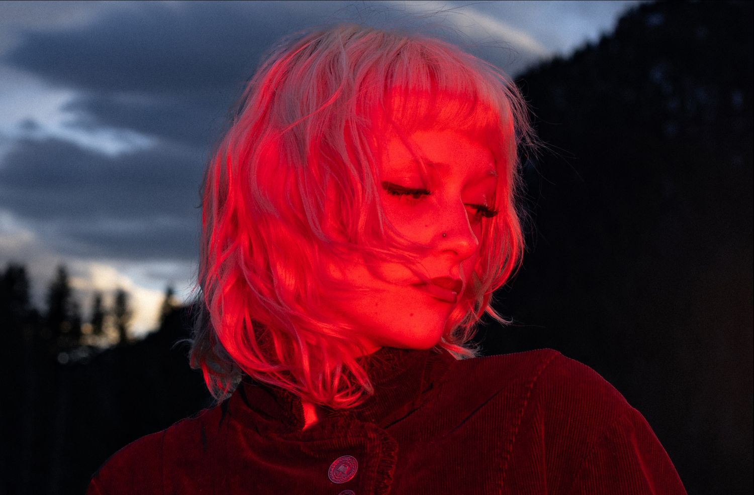 Moody, artistic solo portrait shot during blue hour in Utah.