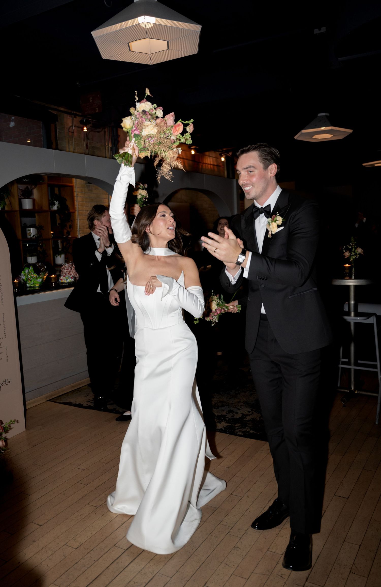 A joyful celebration on the dance floor as a couple dances together at their wedding reception.