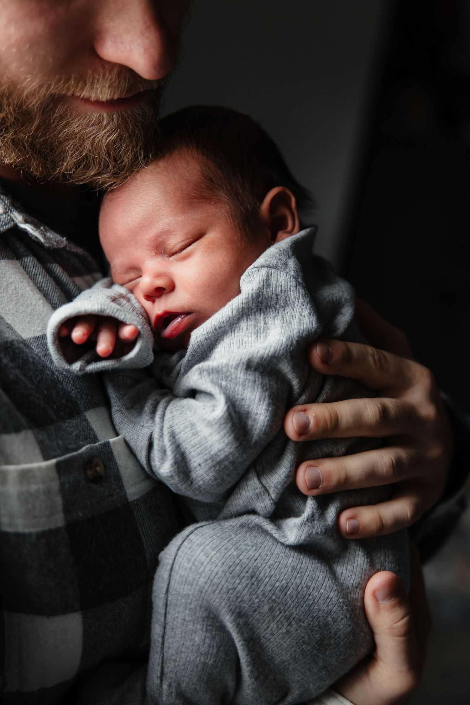 Newborn is snuggled and sleeping for newborn photos