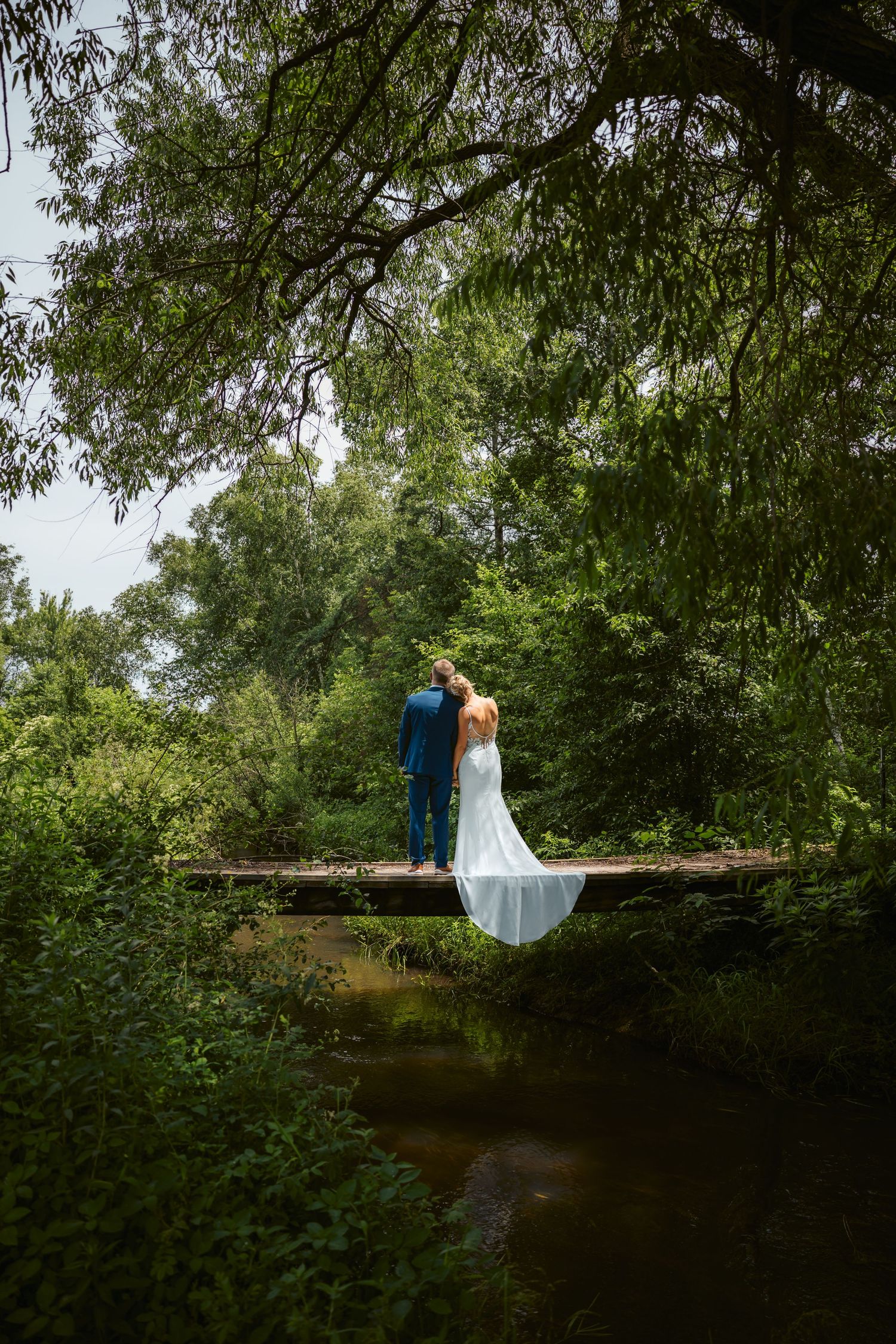 Bemidji couple enjoys nature on their wedding day as they overlook a river