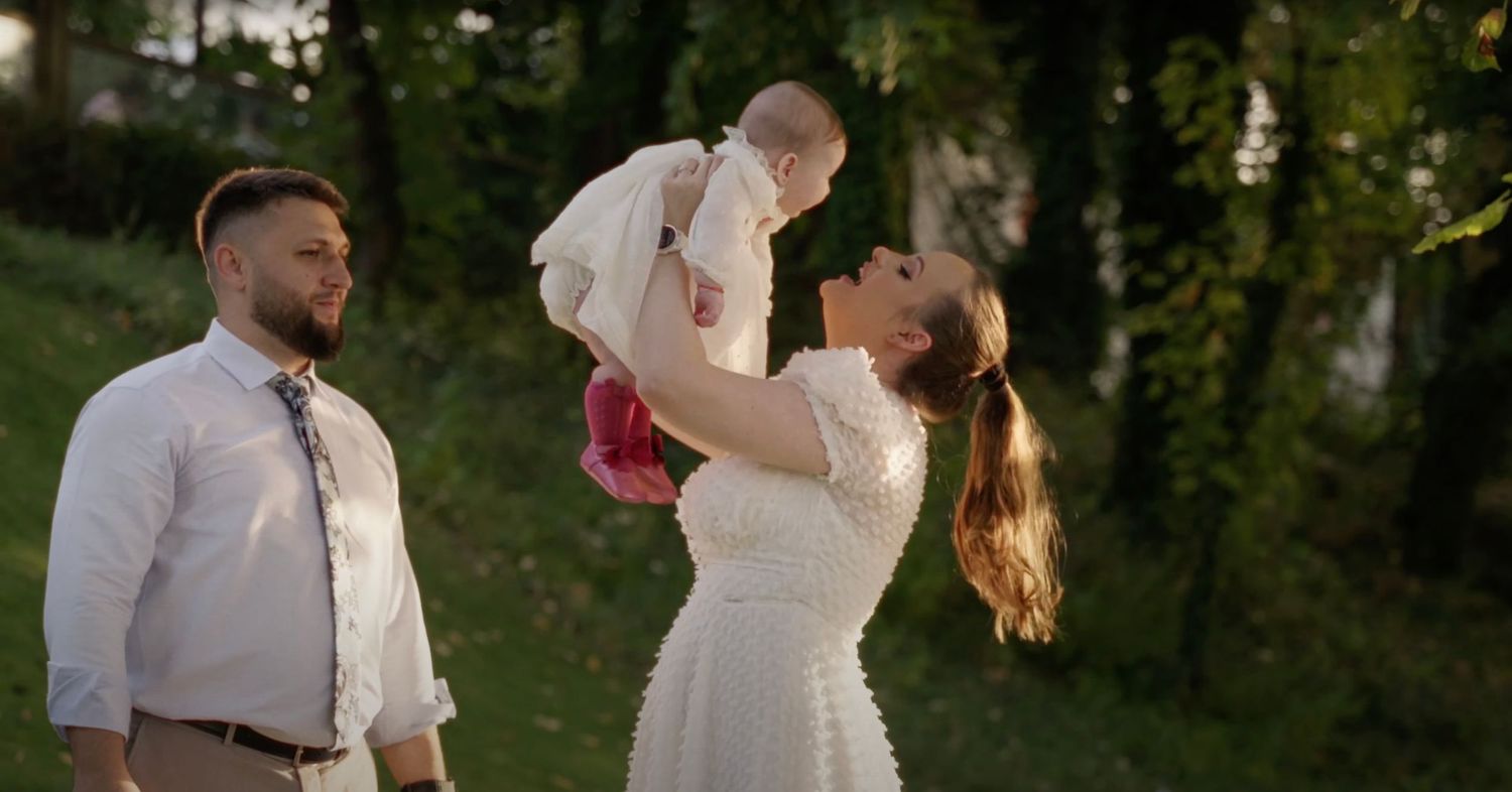 Capture the love and faith of your family’s baptism with a beautiful photo of the parents and child.