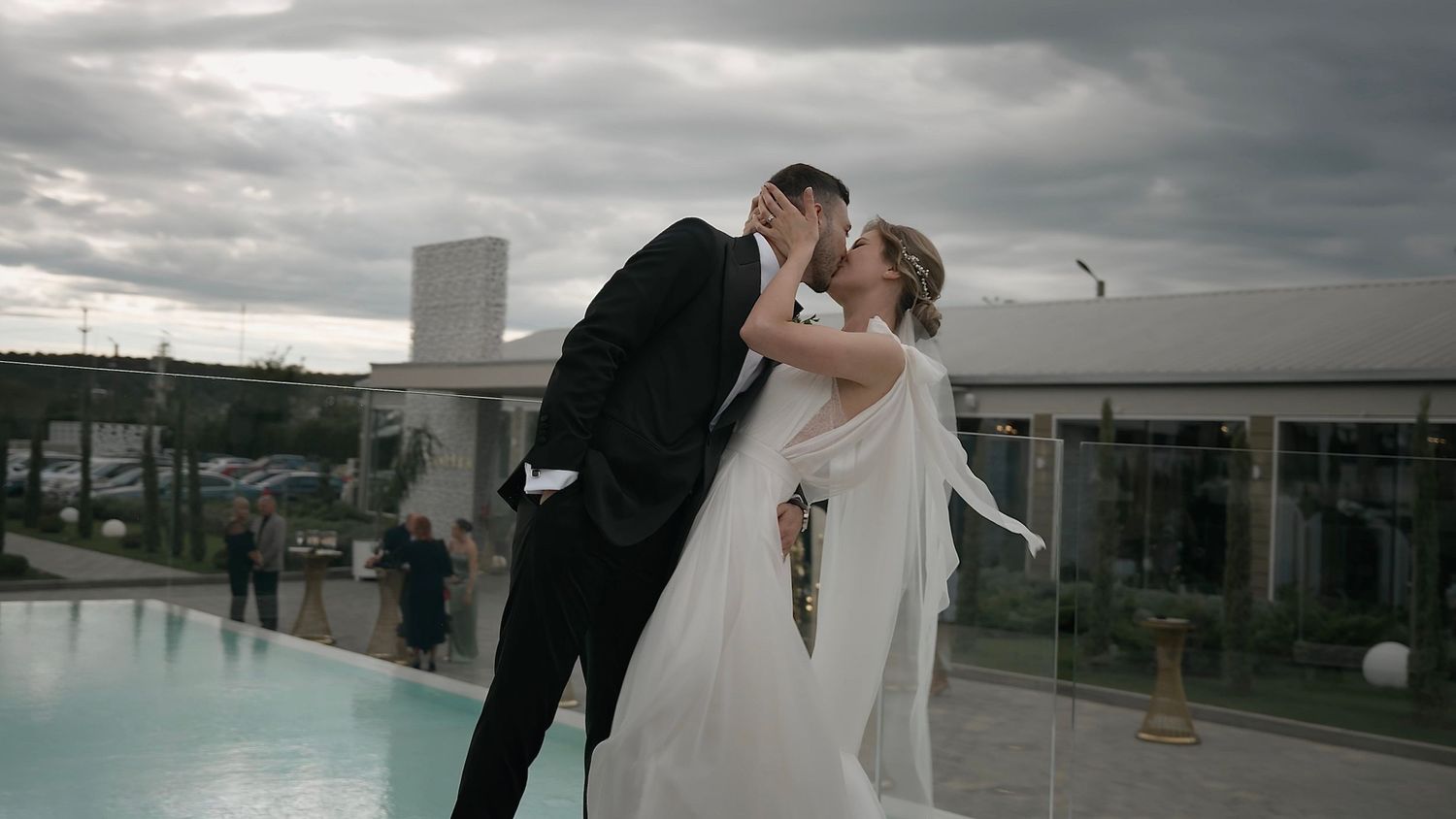 Bride and groom sharing a romantic kiss on their wedding day