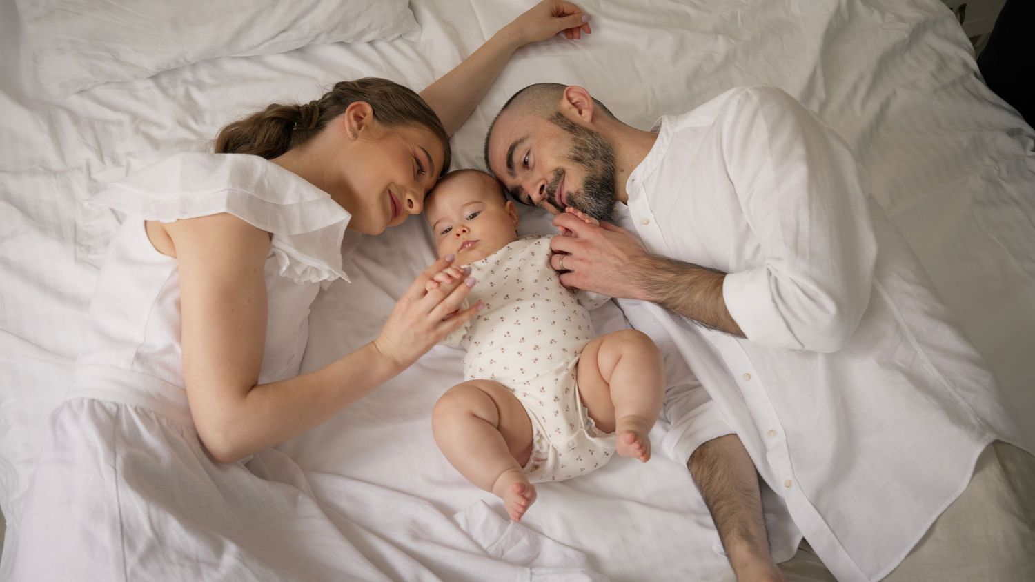 Capture the love and joy of your baby’s baptism with a beautiful family photo, commemorating this special occasion.