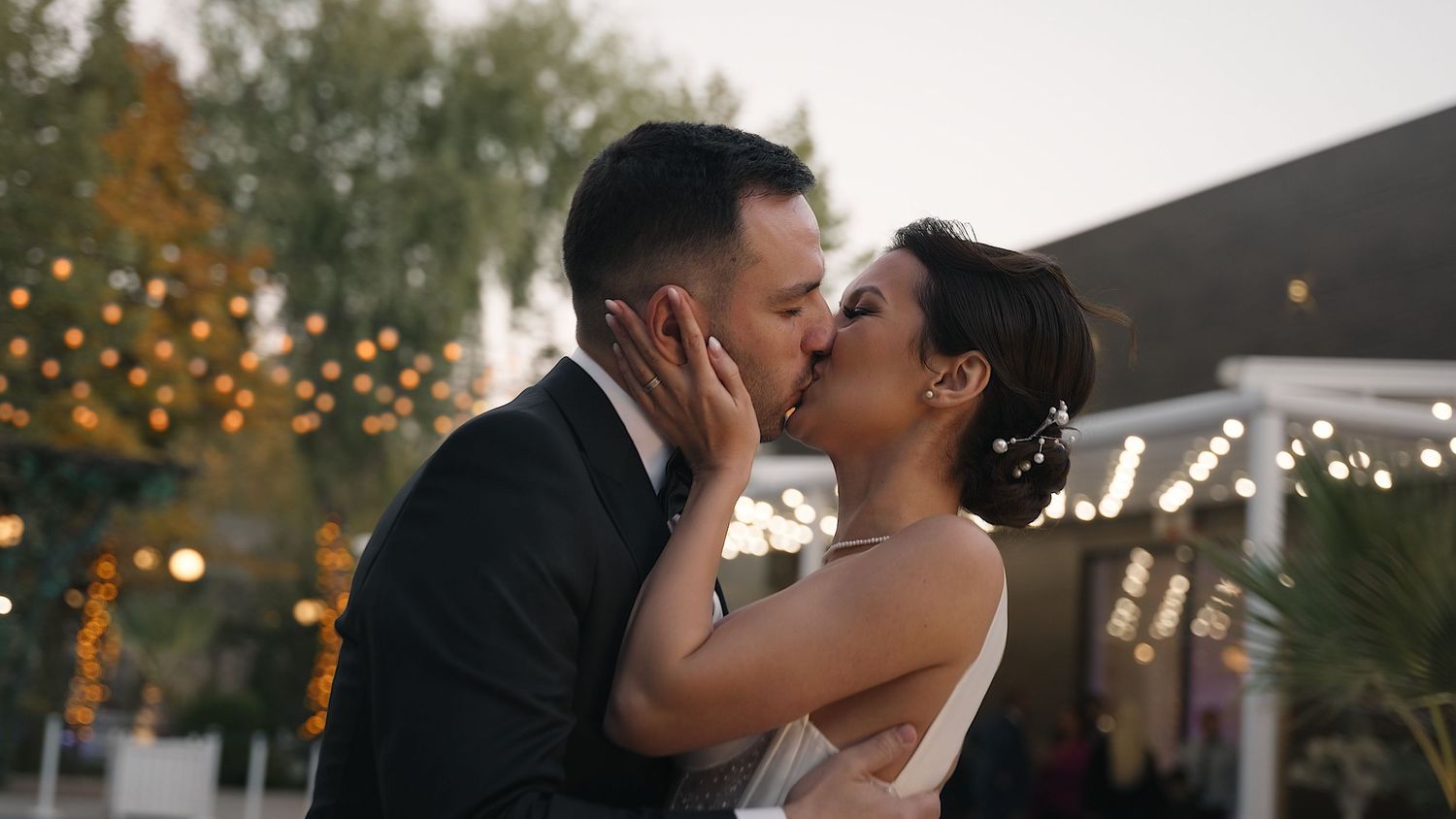 Seal your wedding day with a kiss! Capture the intimate moment between the bride and groom, creating a beautiful, romantic wedding memory.