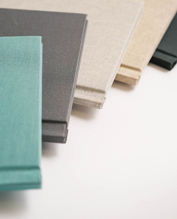 Selection of linen photo album covers in multiple neutral colour options.
