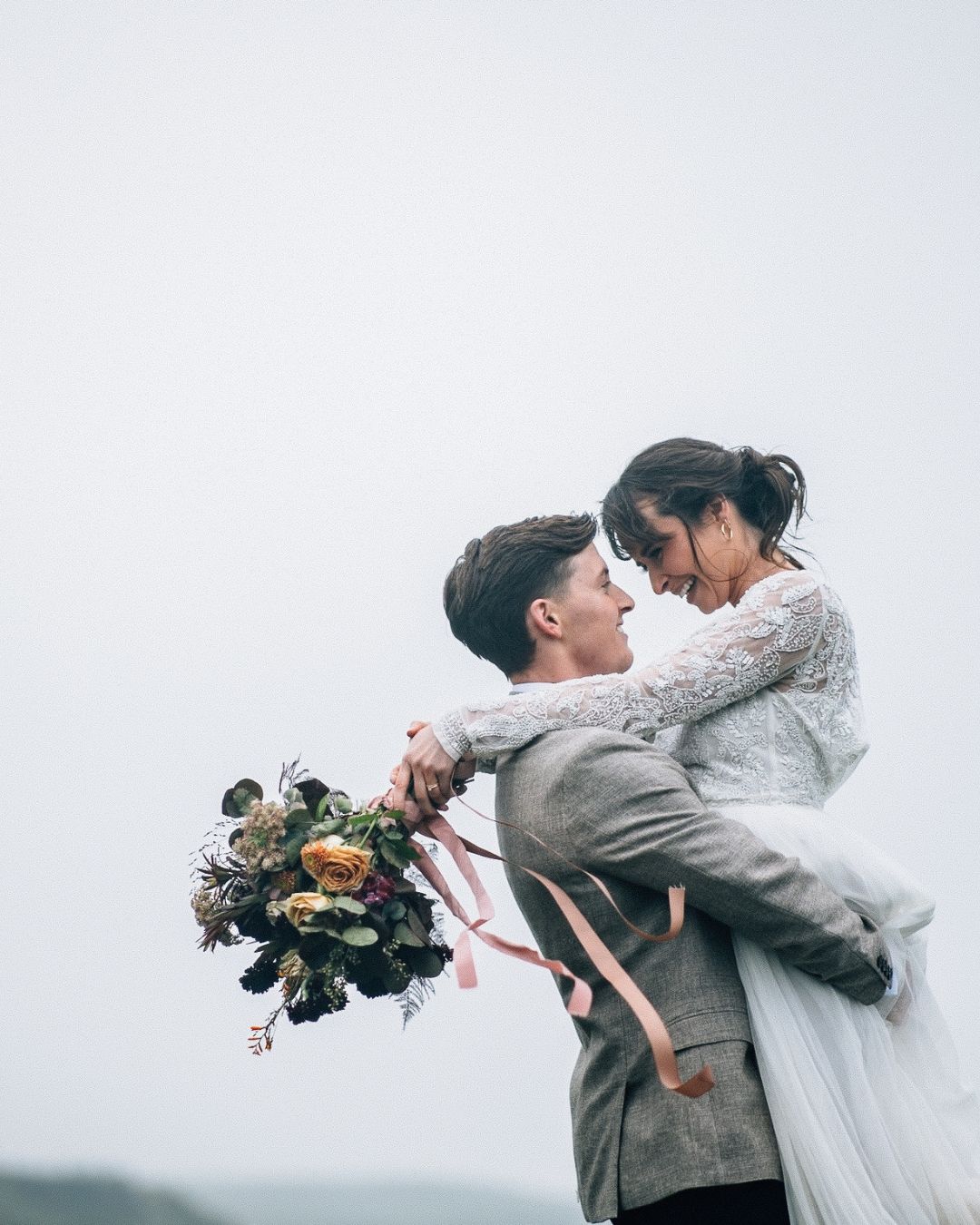 A romantic wedding couple embraces and kisses in an intimate moment captured in a series of four artistic photographs.