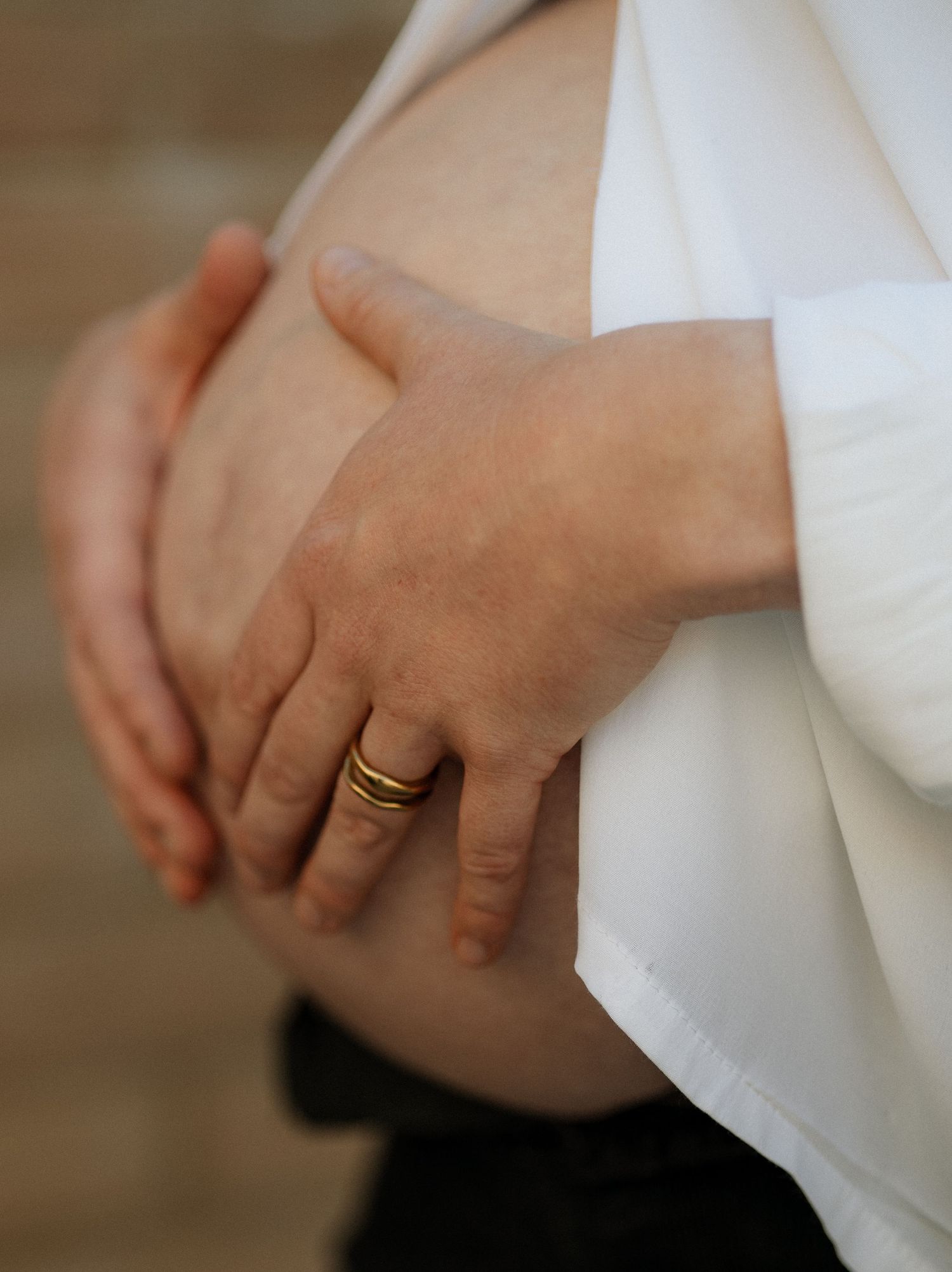 Pregnant mum cradling her bump during a Winchester maternity session