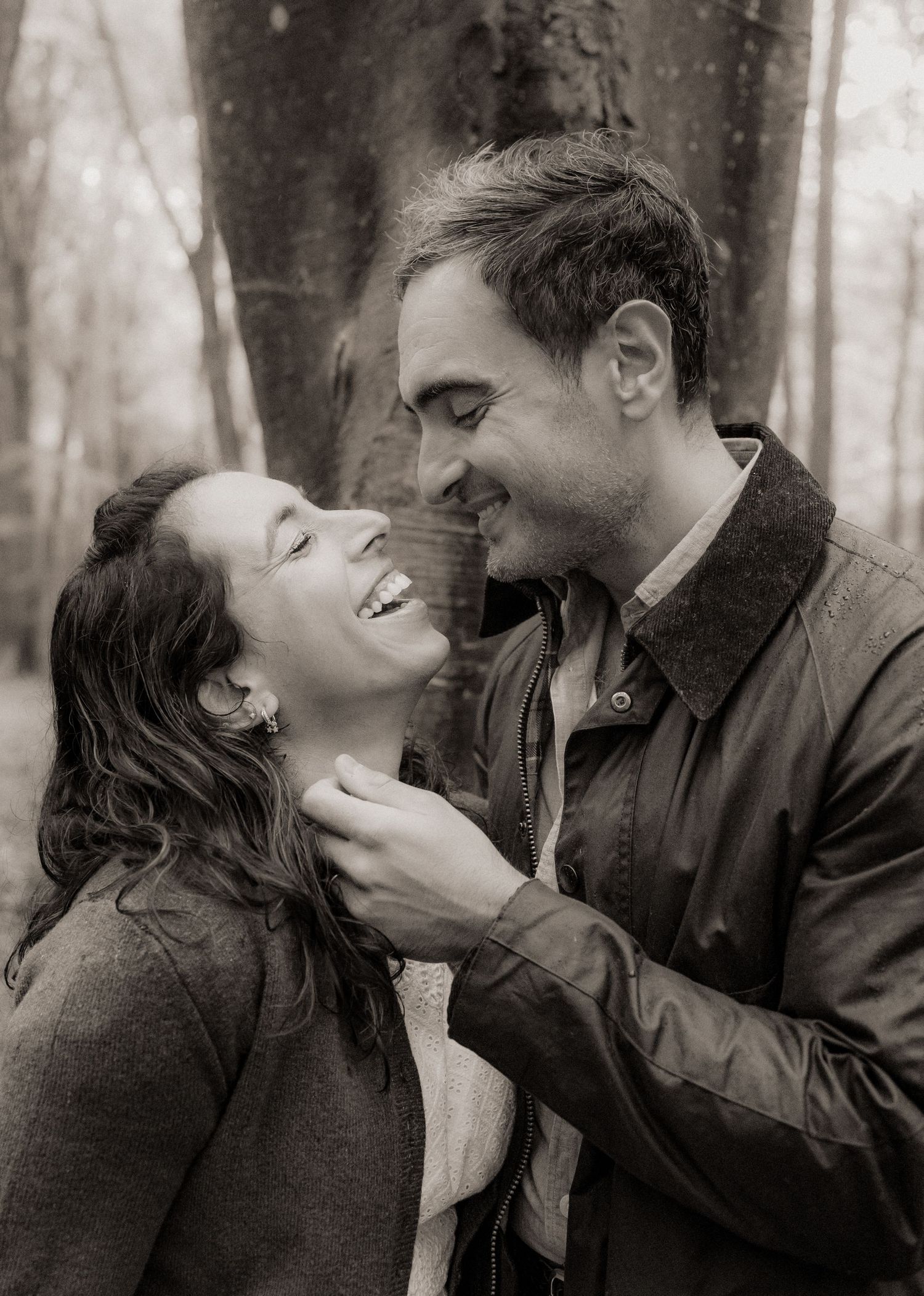 Mum and Dad laughing together during their Micheldever Woods family photoshoot