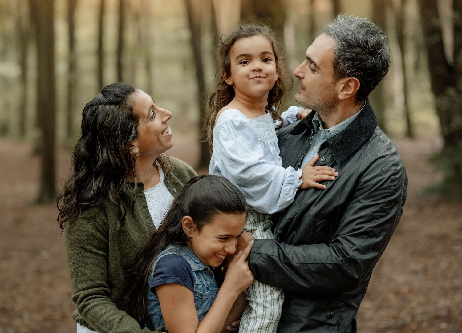 Family of four during a relaxed photoshoot in Micheldever Woods near Winchester
