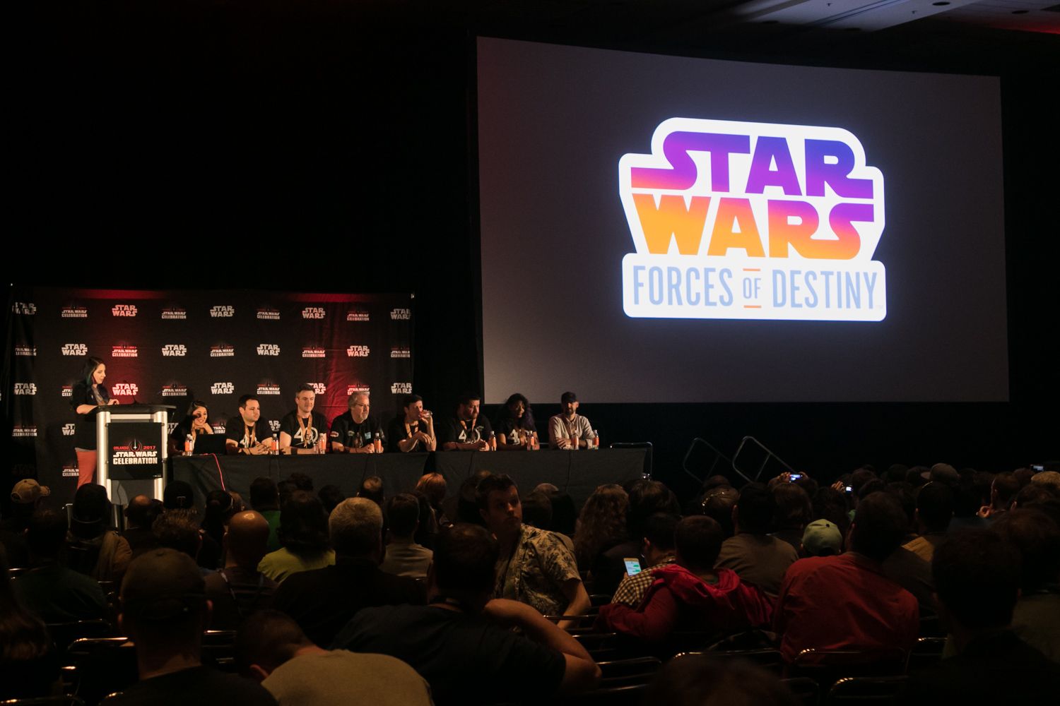 Star Wars Forces of Destiny panel presentation at large convention with audience and projected logo.